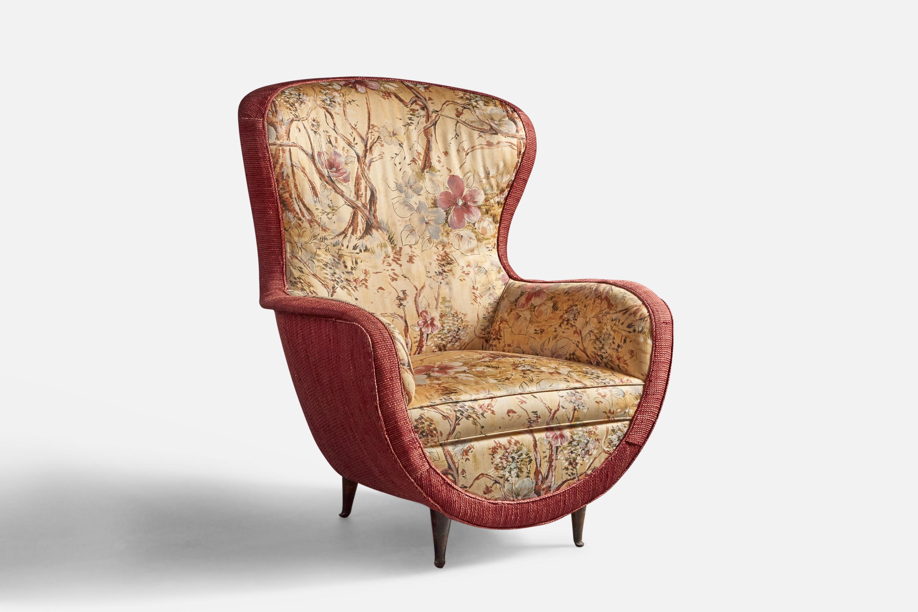 A red and printed floral fabric and wood lounge chair, designed and produced in Italy, 1940s.
