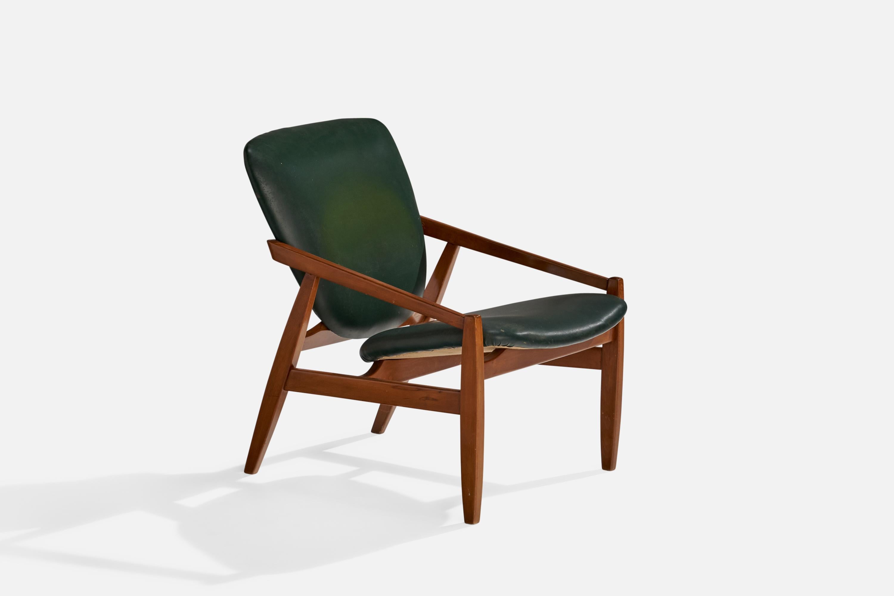 A teak and green vinyl lounge chair designed and produced in Italy, 1960s.

Seat height 15.5”.