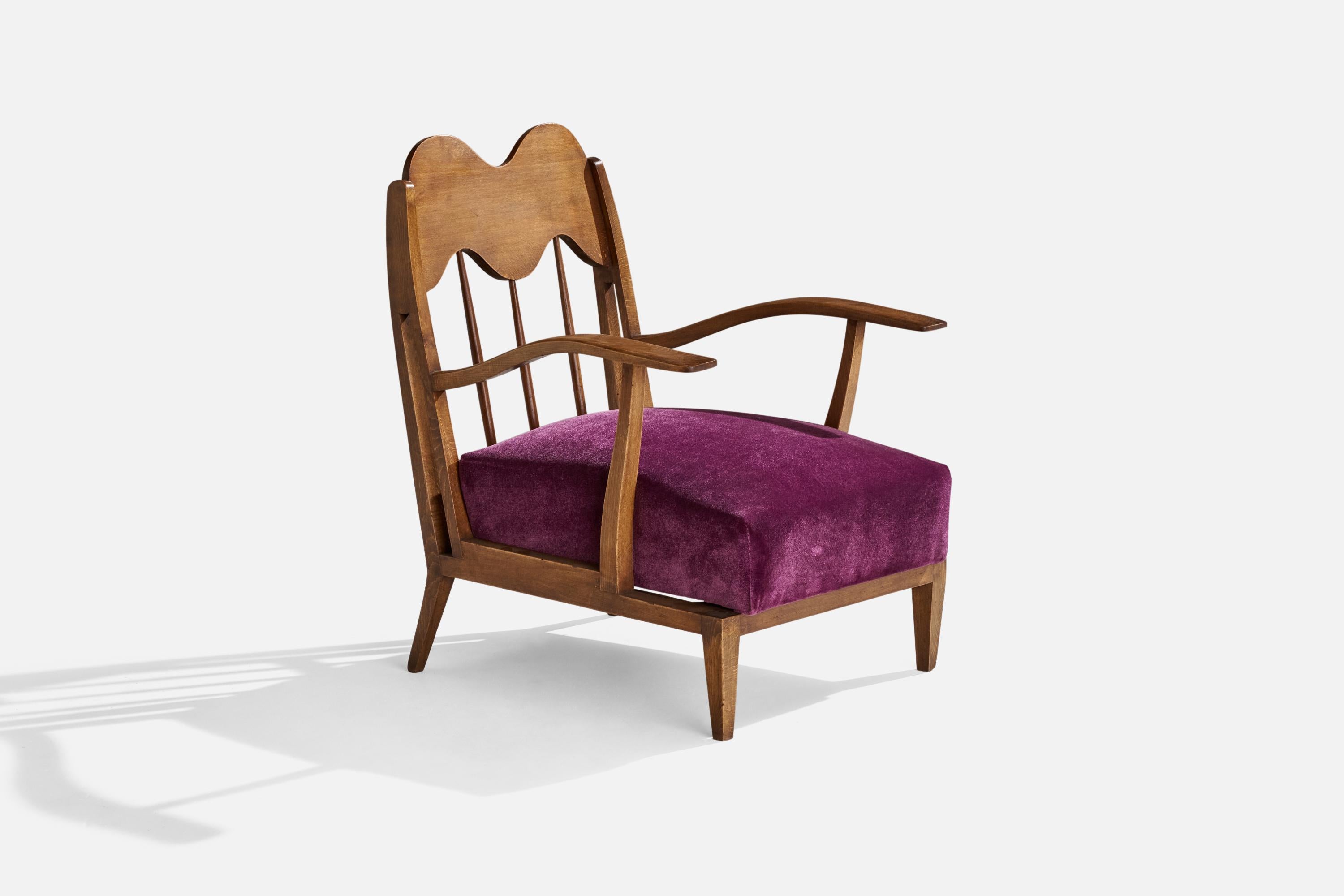 A walnut and purple velvet lounge chair designed and produced in Italy, c. 1940s.

Seat height: 13”