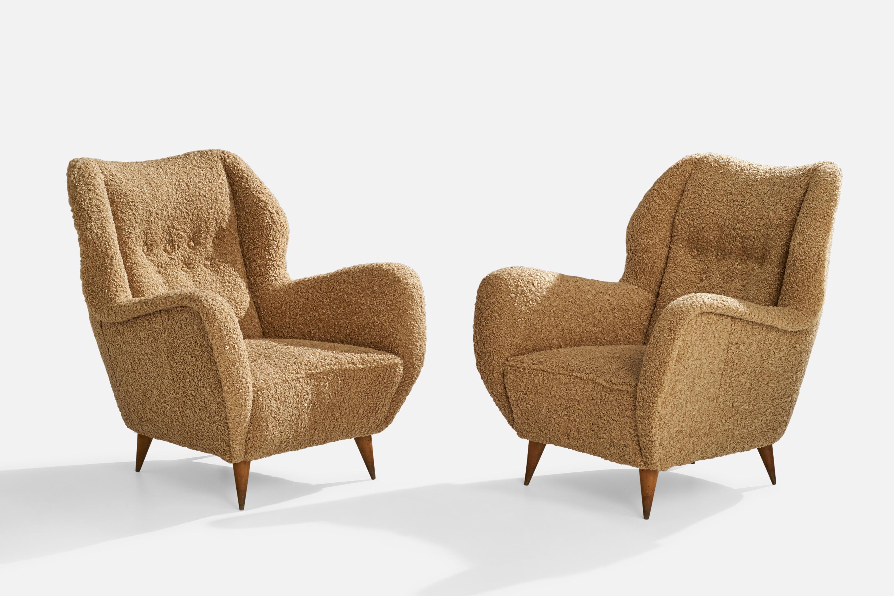 A pair of brown beige bouclé fabric and wood lounge chairs designed and produced in Italy, c. 1940s.

Seat height 15”