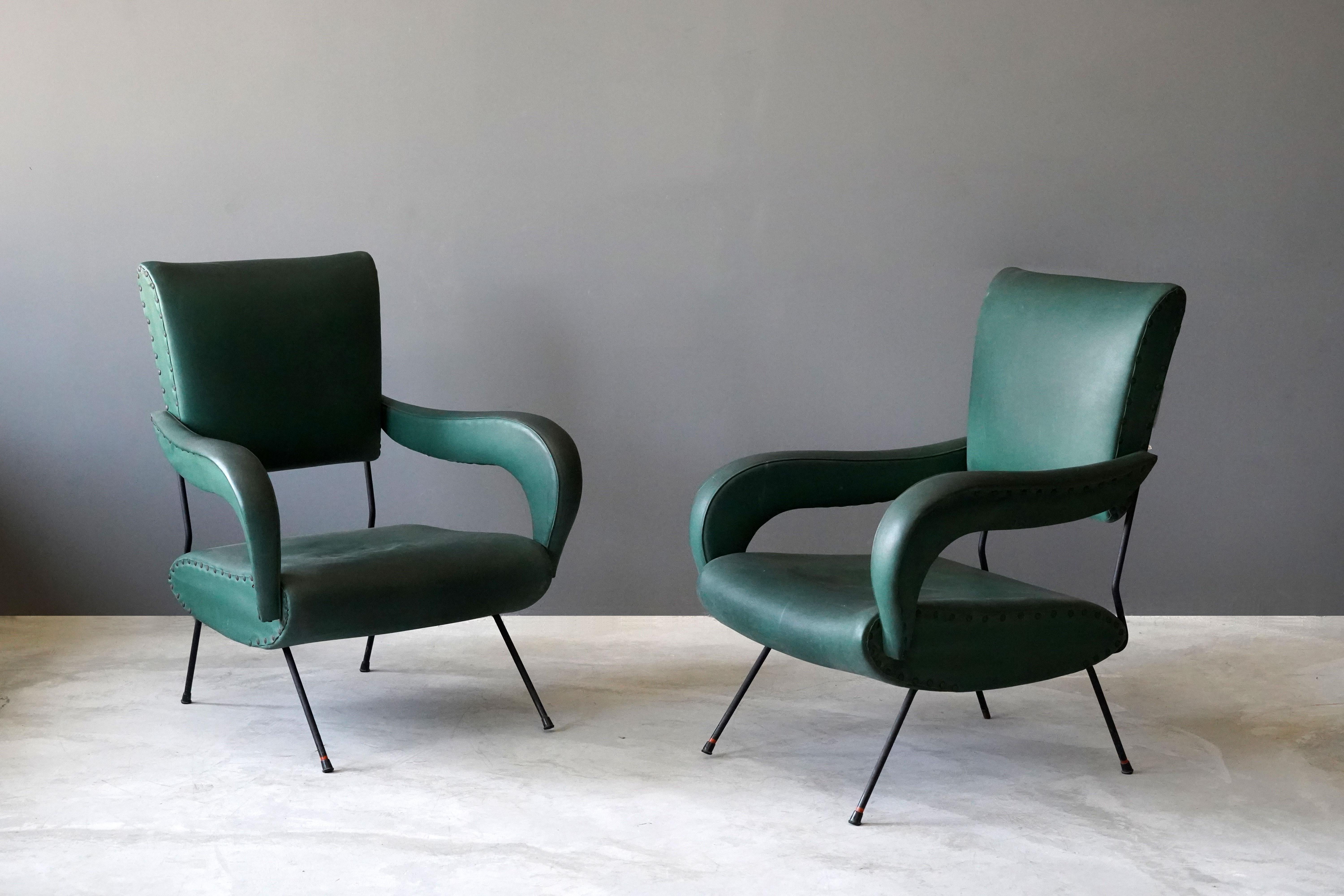 A pair of organic lounge chairs / arm chairs. Designed and produced in Italy, 1950s. 

Other designers of the period include Carlo Mollino, Augusto Bozzi, Isamu Noguchi, Vladimir Kagan, and Gastone Rinaldi.