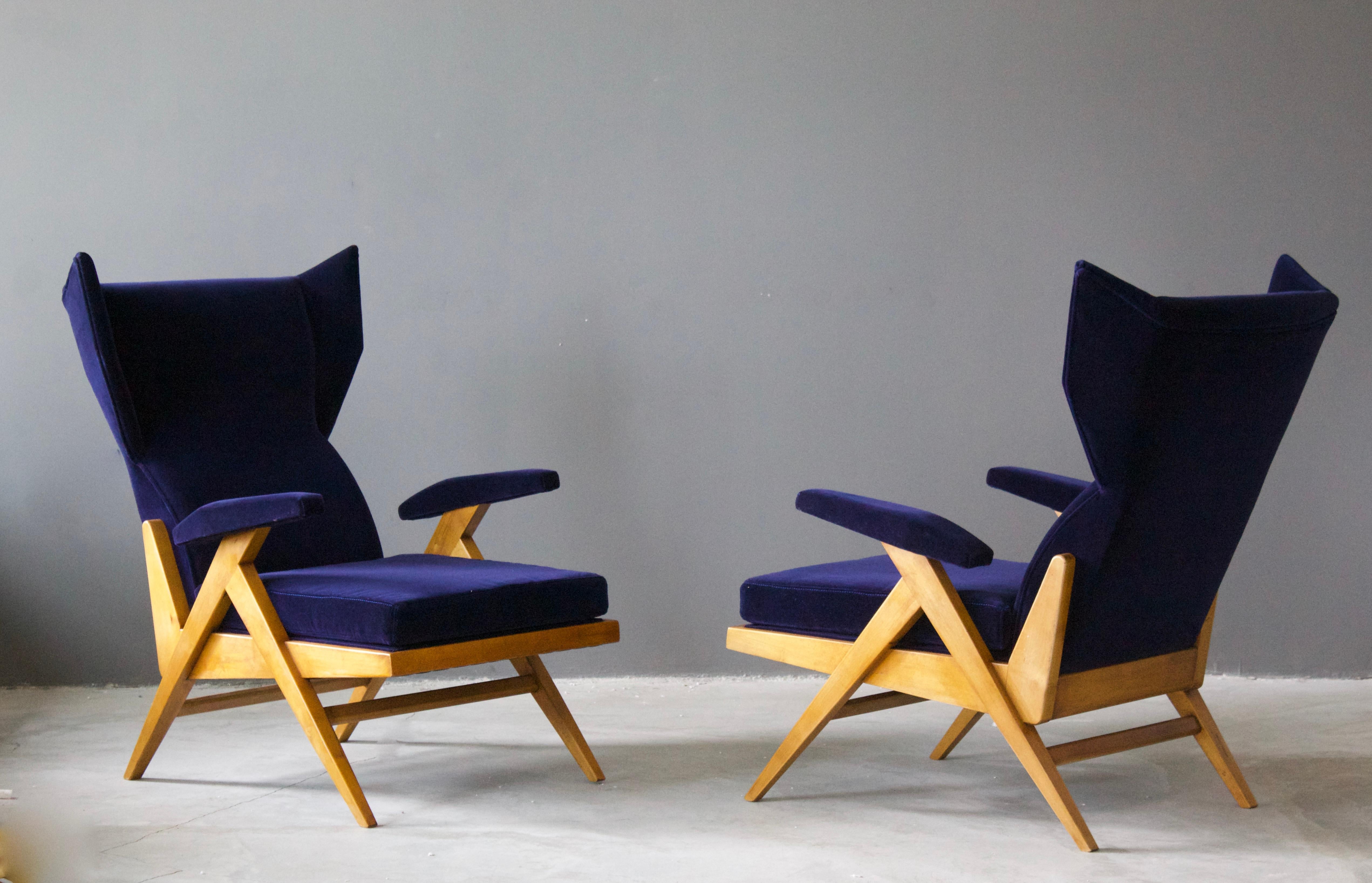 A pair of highly modernist lounge chairs. Designed by Renzo Franchi, Italy, 1950s. Restored and reupholstered in a brand new blue velvet fabric in recent time.

Other designers of the period include Ico Parisi, Gio Ponti, Franco Albini, Vladimir