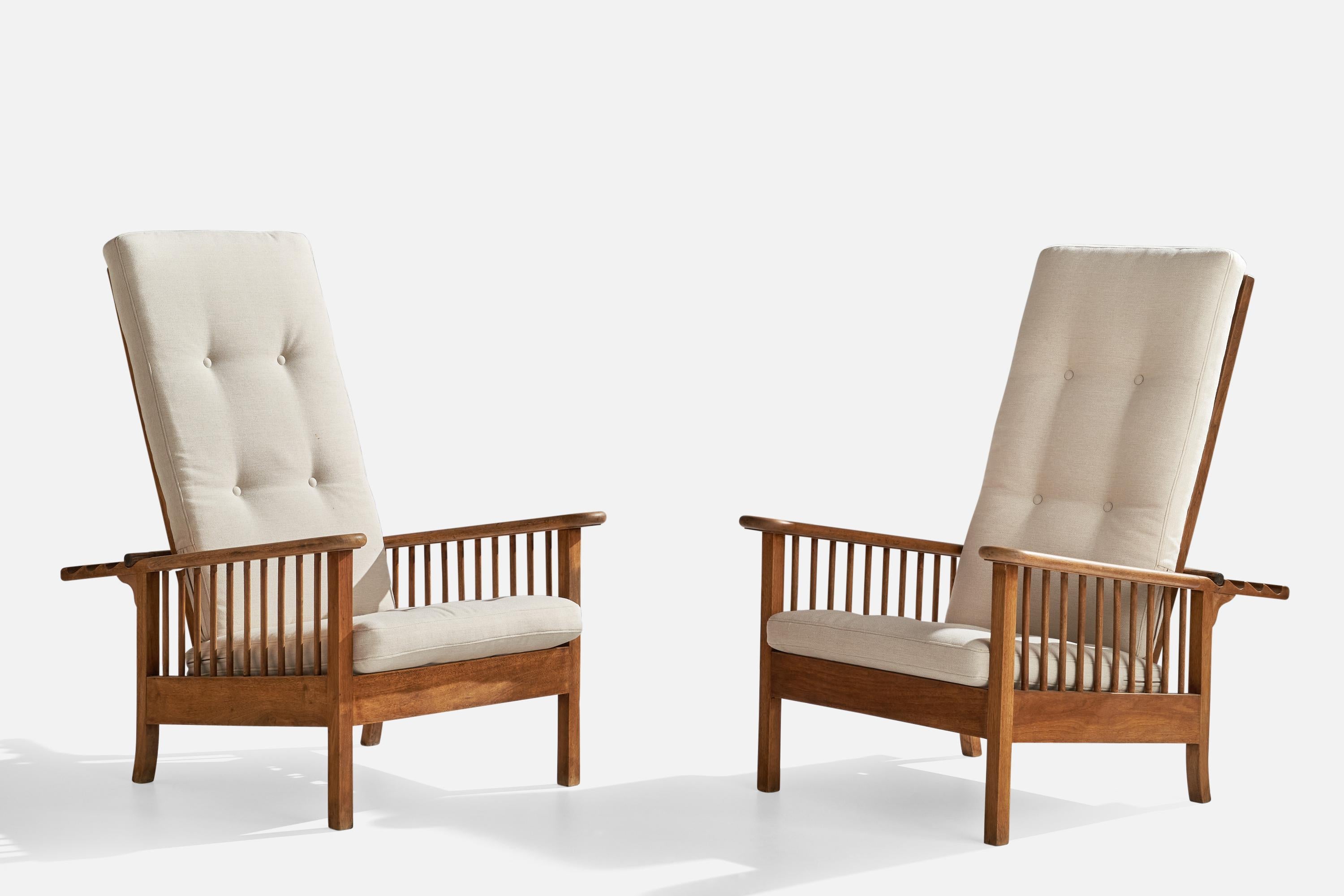 A pair of adjustable high-back oak, brass and off-white fabric lounge chairs designed and produced in Italy, 1940s.

Seat height: 14.75”
 