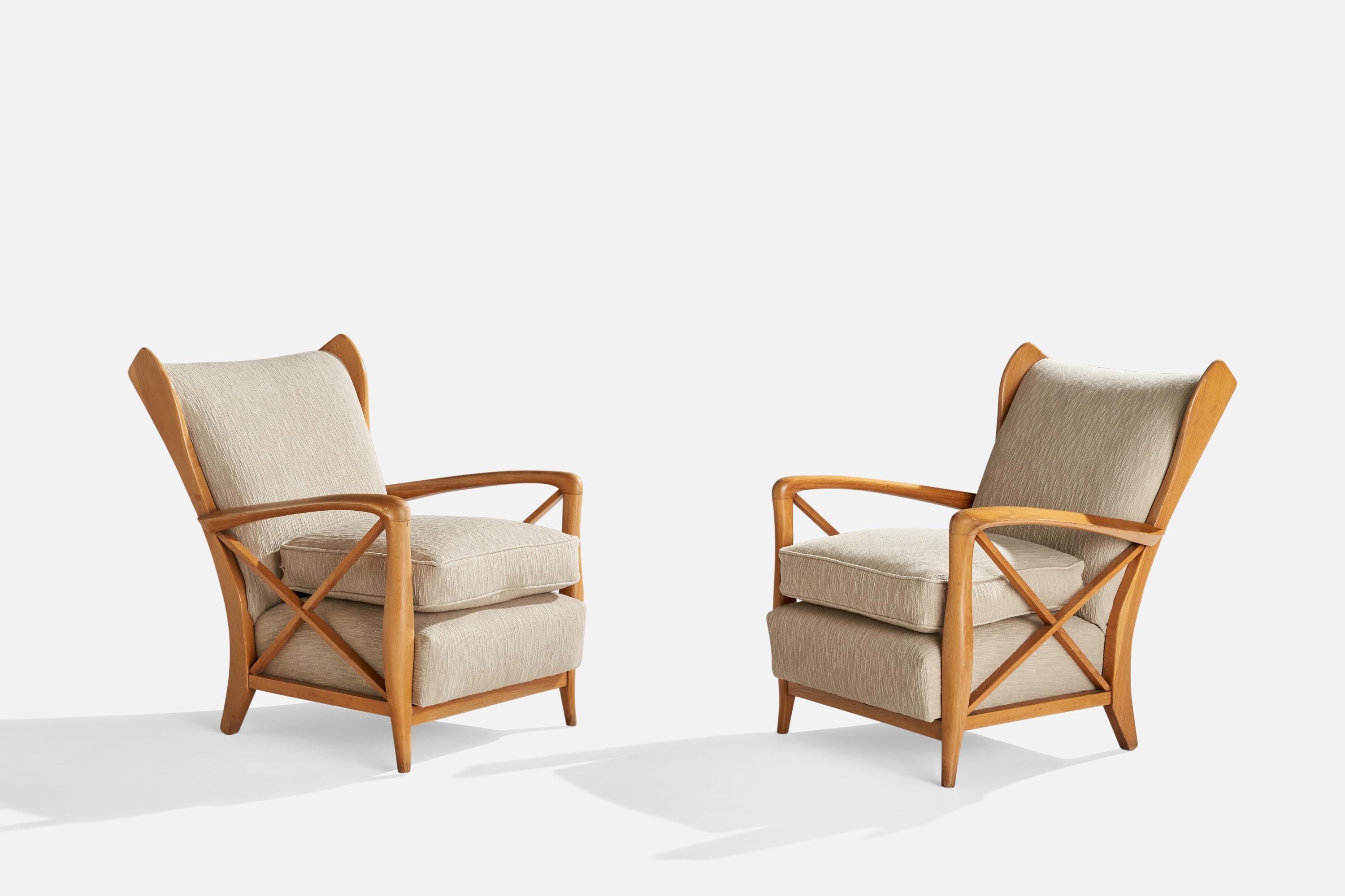 A pair of sizeable oak and beige fabric lounge chairs designed and produced in Italy, 1940s.

Seat height 18.5”.