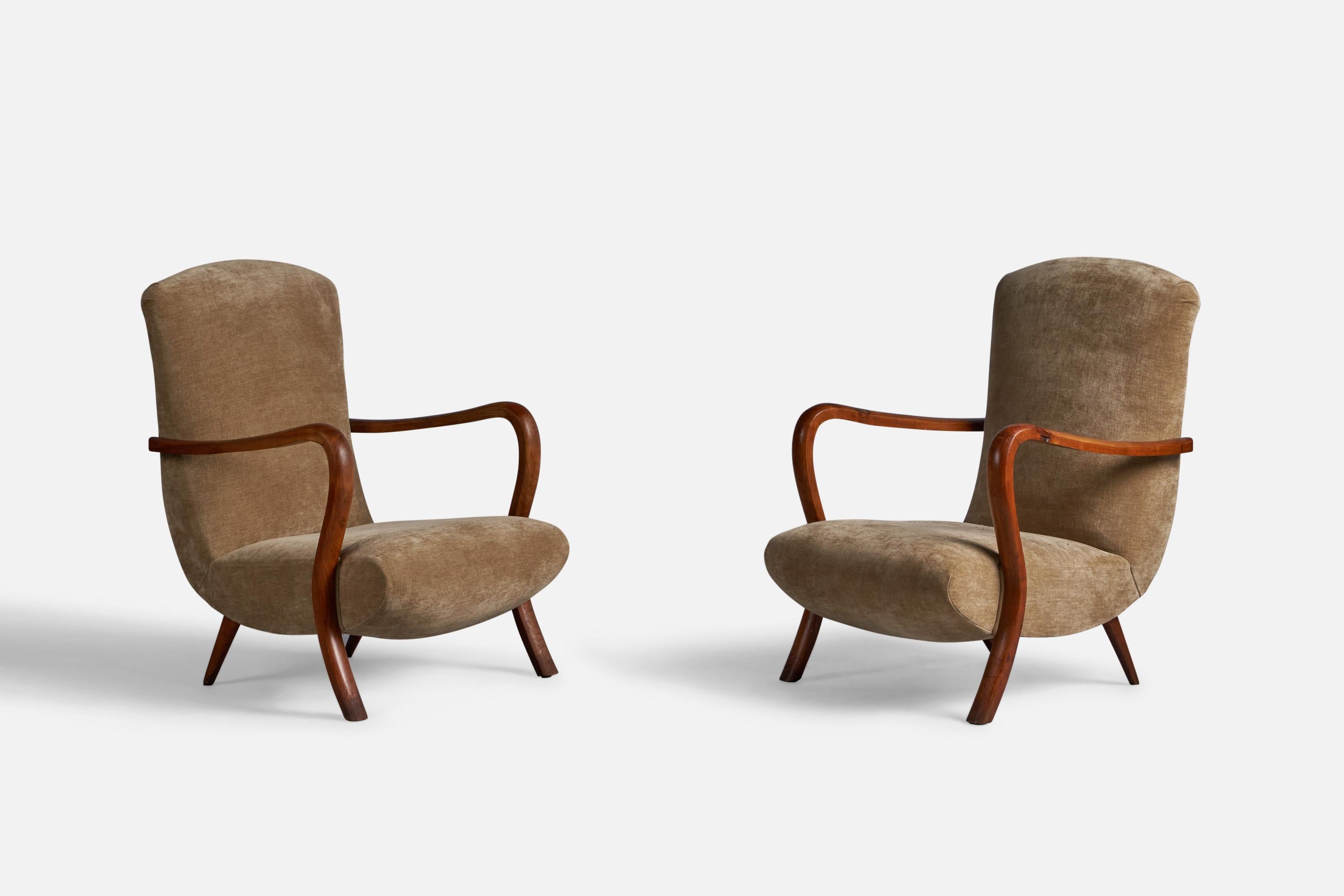 A pair of solid stained oak and beige velvet lounge chairs designed and produced in Italy, 1940s.

15