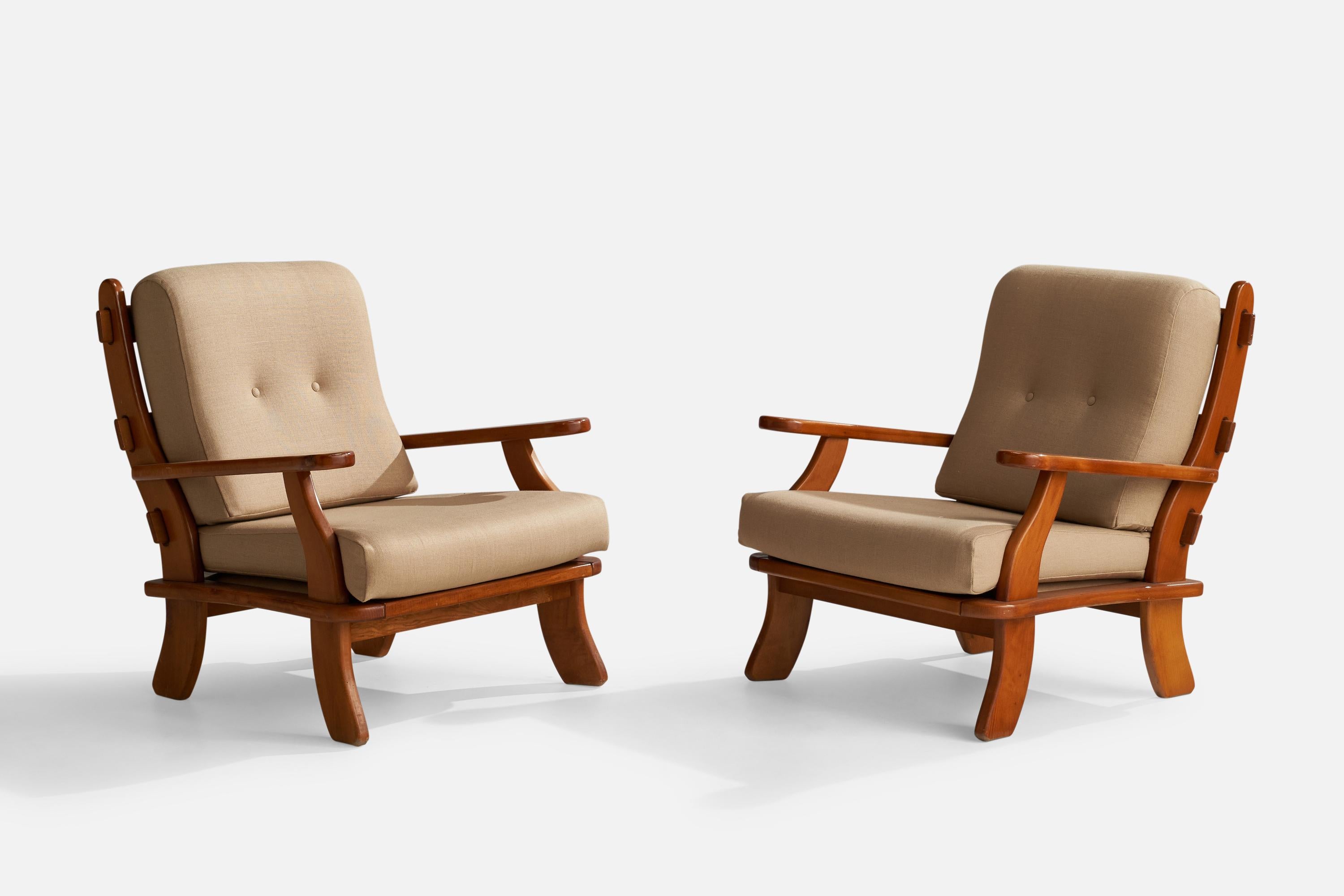 A pair of pine and beige fabric lounge chairs designed and produced in Italy, 1970s.

Seat height 16”