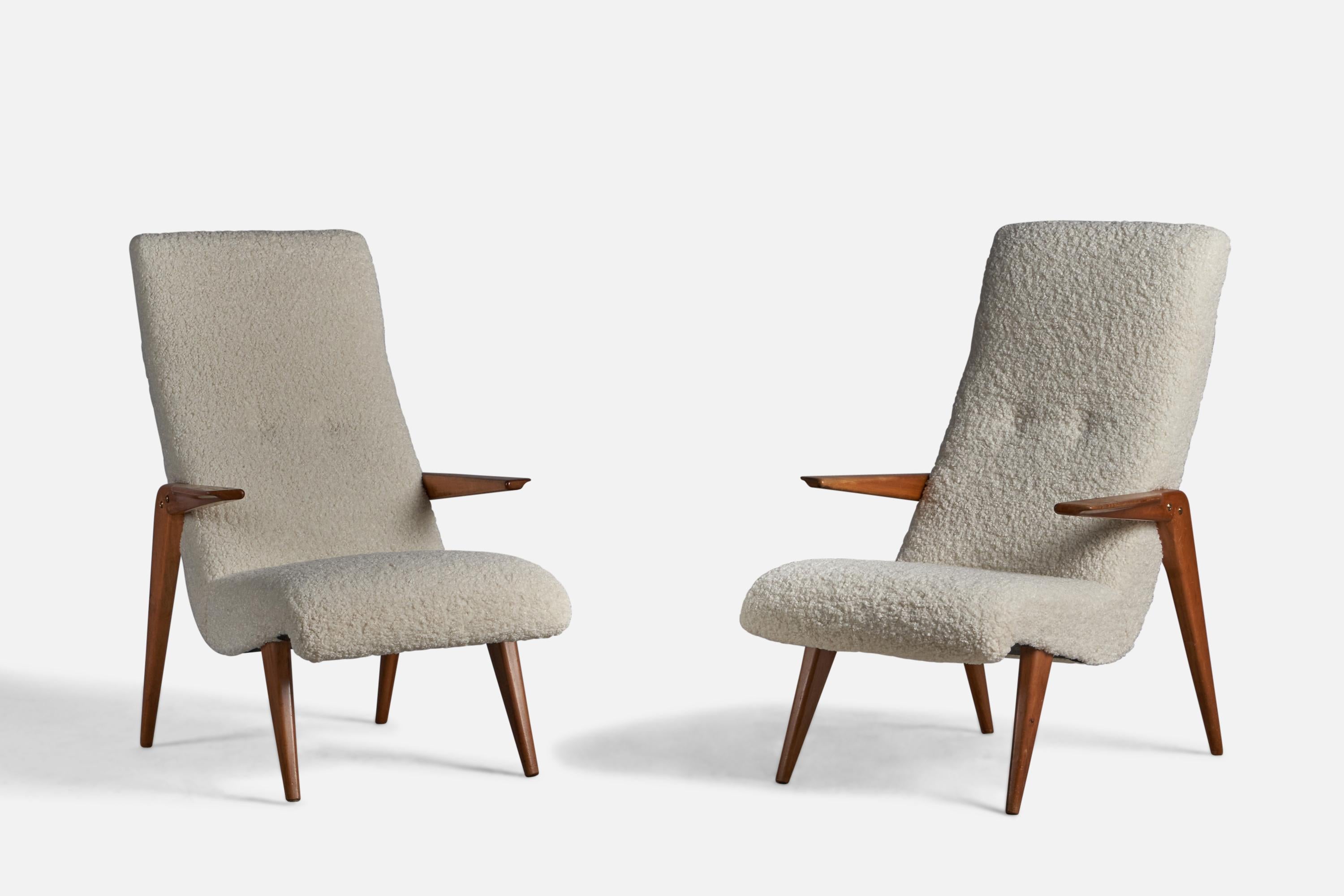 A pair of walnut and fabric lounge chairs, designed and produced in Italy, 1950s.

15.5” seat height
 