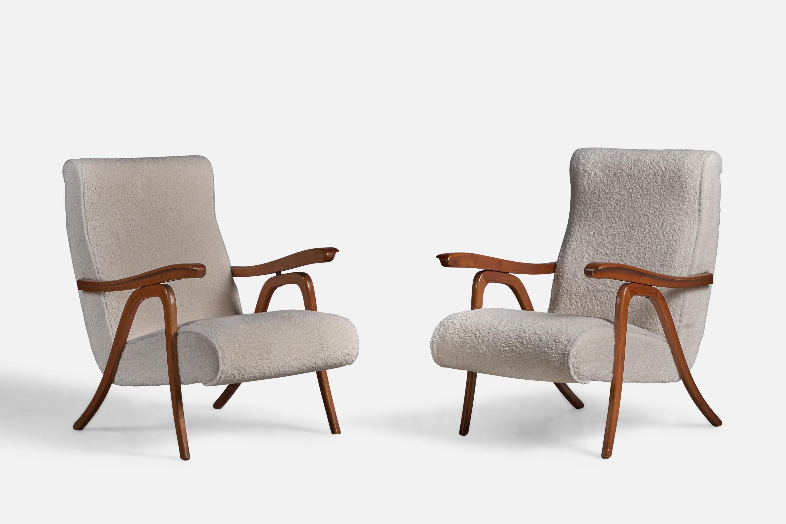 A pair of adjustable walnut and white bouclé fabric lounge chairs designed and produced in Italy, 1950s.

15.5” seat height
