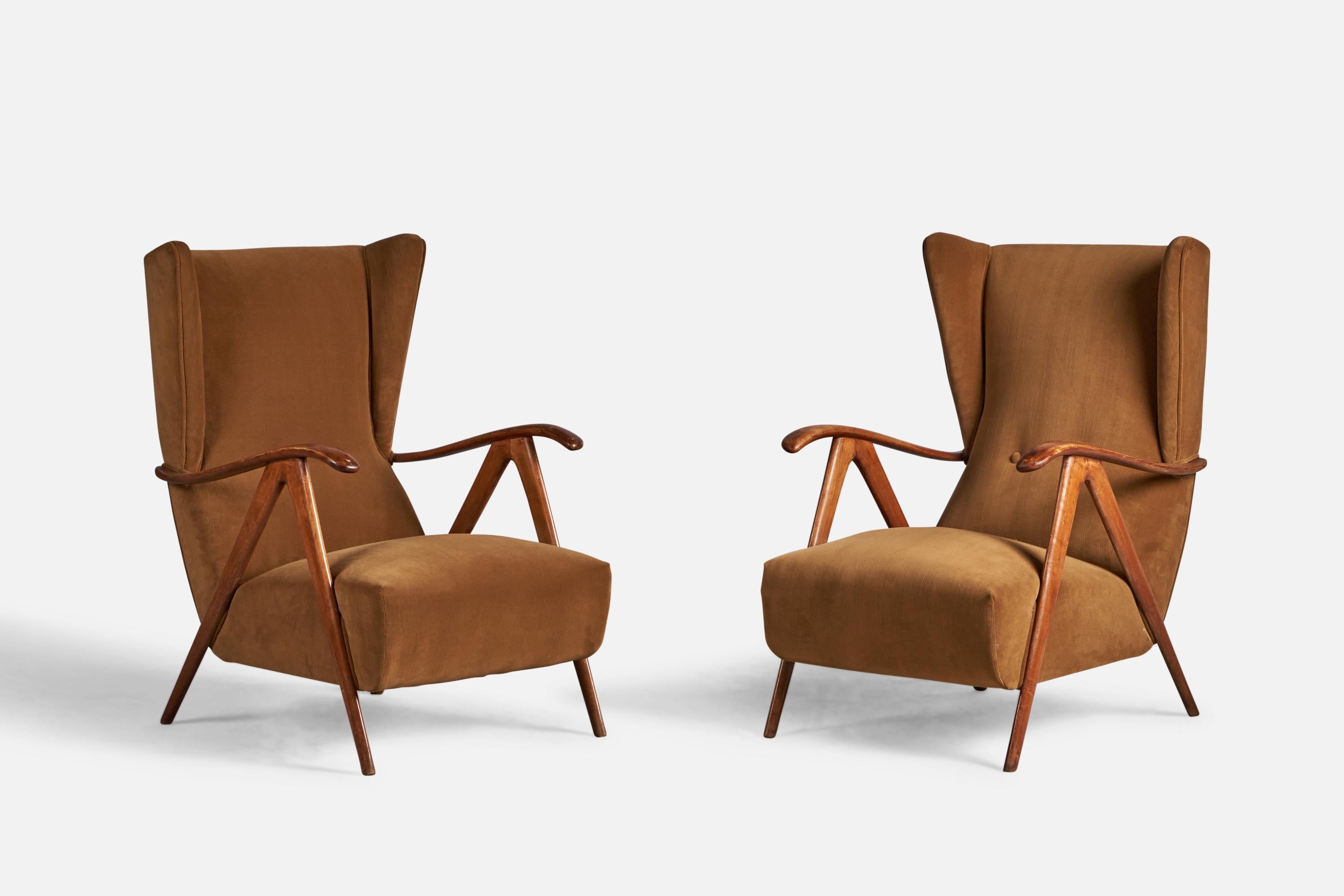 A pair of walnut and velvet lounge chairs, designed and produced in Italy, 1940s.

14
