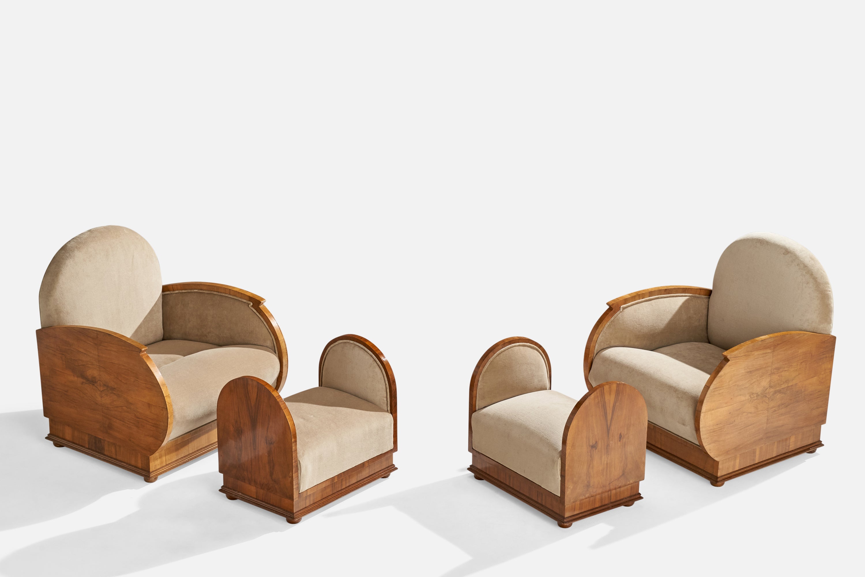 A pair of walnut and beige velvet lounge chairs with ottomans designed and produced in Italy, c. 1930s.

Seat height 16”.
