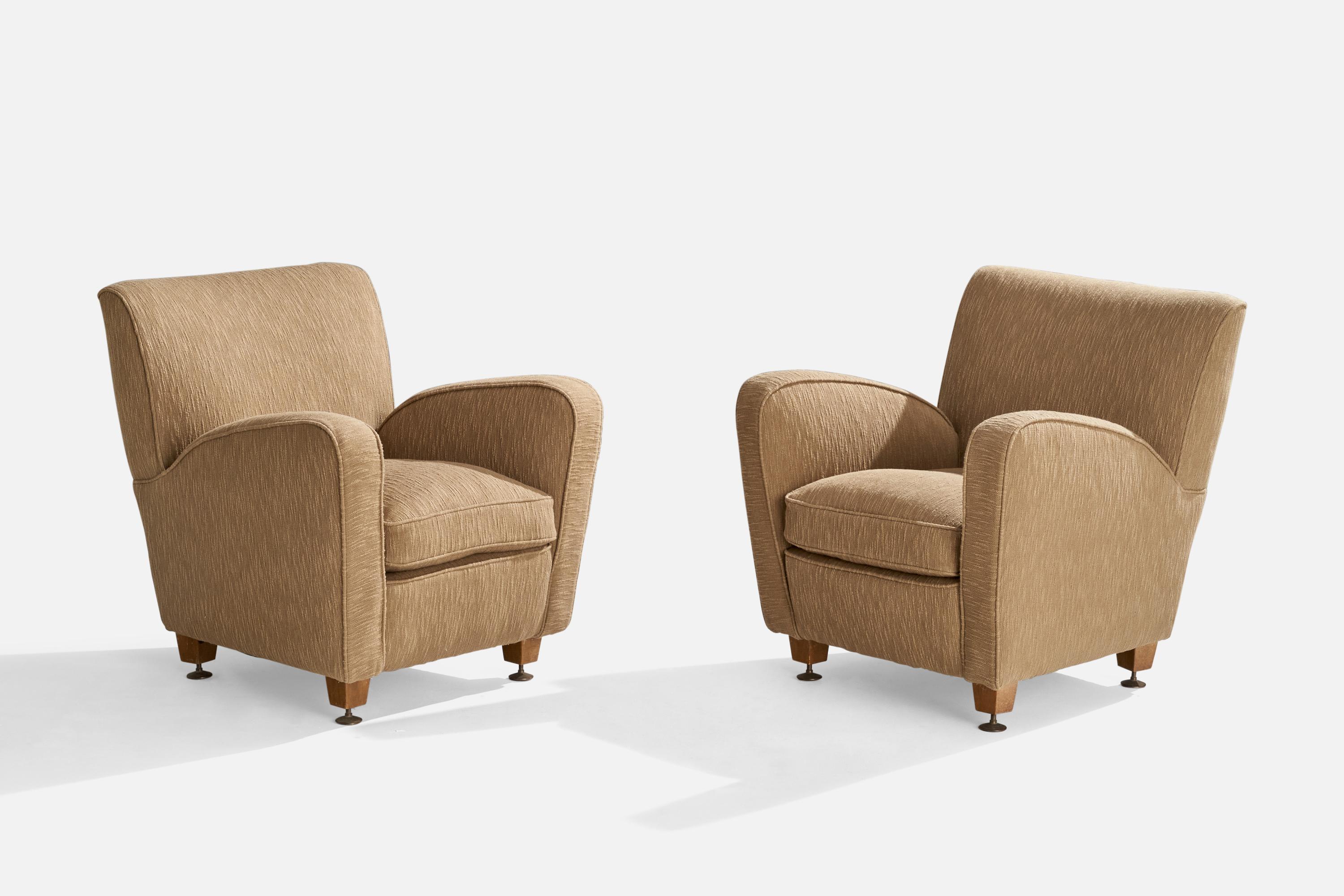 A pair of beige fabric, wood and brass lounge chairs designed and produced in Italy, 1940s.

Seat height: 17”