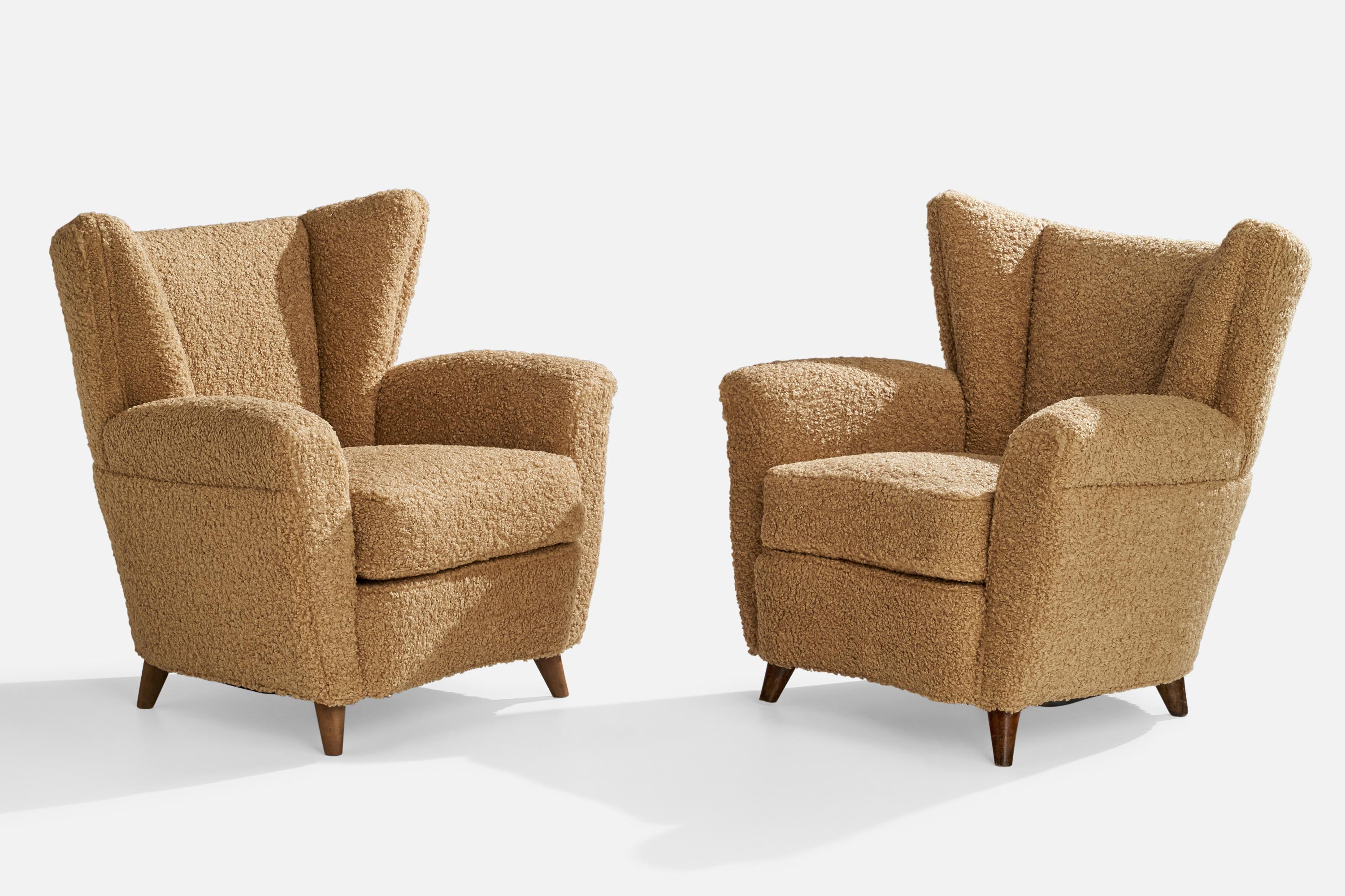 A pair of beige brown bouclé fabric and dark-stained wood lounge chairs designed and produced in Italy, 1940s.

Seat height 17.5”.