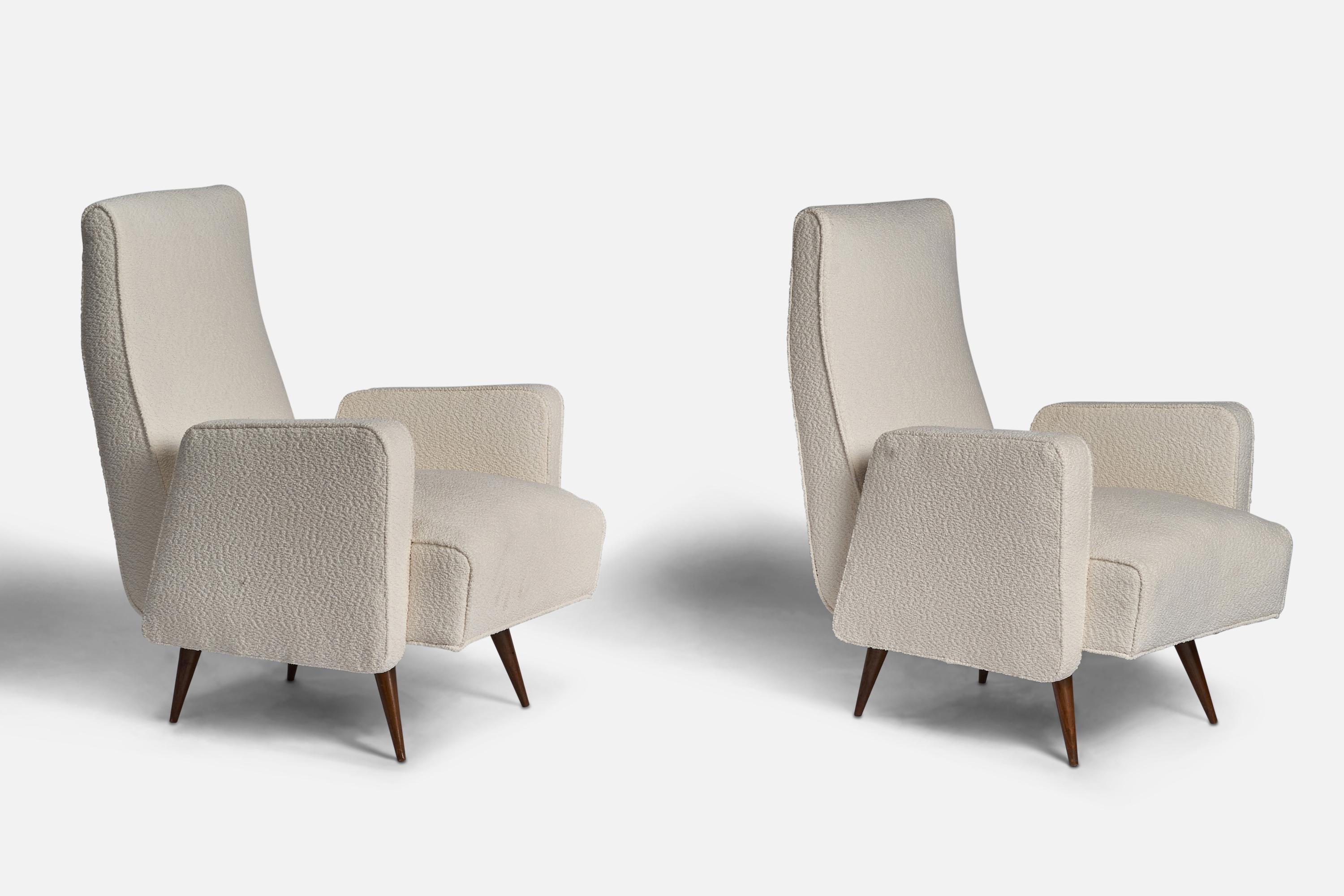 A pair of white bouclé fabric and wood lounge chairs designed and produced in Italy, 1950s.
Seat height: 14.75