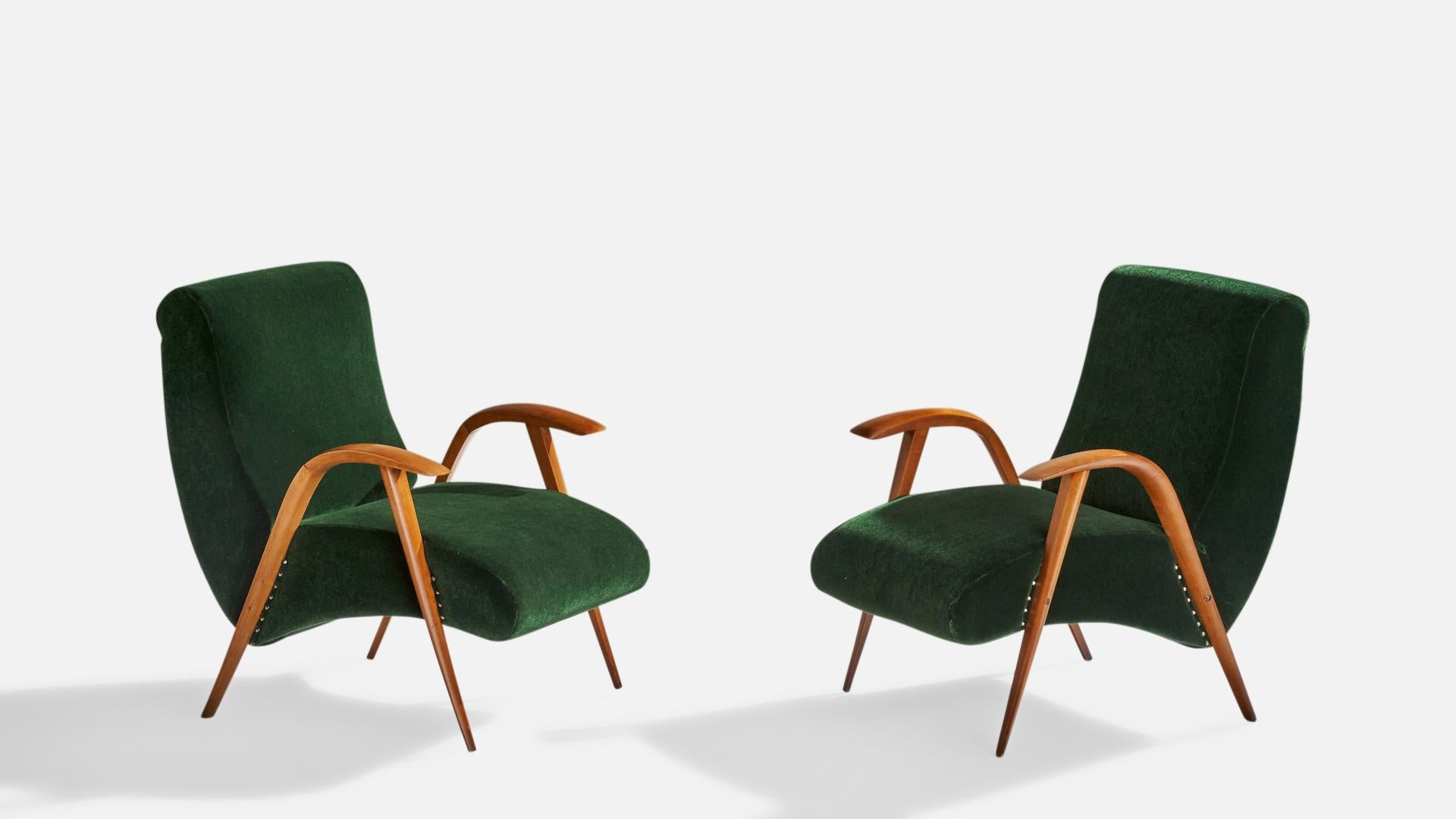 A pair of wood and green velvet lounge chairs designed and produced in Italy, 1940s.

Seat height: 14.18