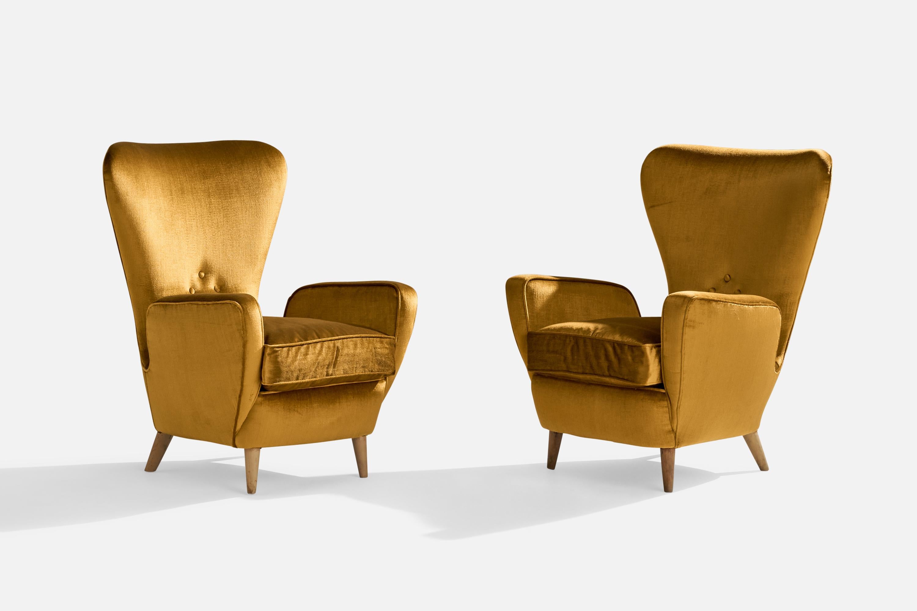 A pair of yellow gold velvet and wood lounge chairs designed and produced in Italy, 1950s.

seat height 17.3”.