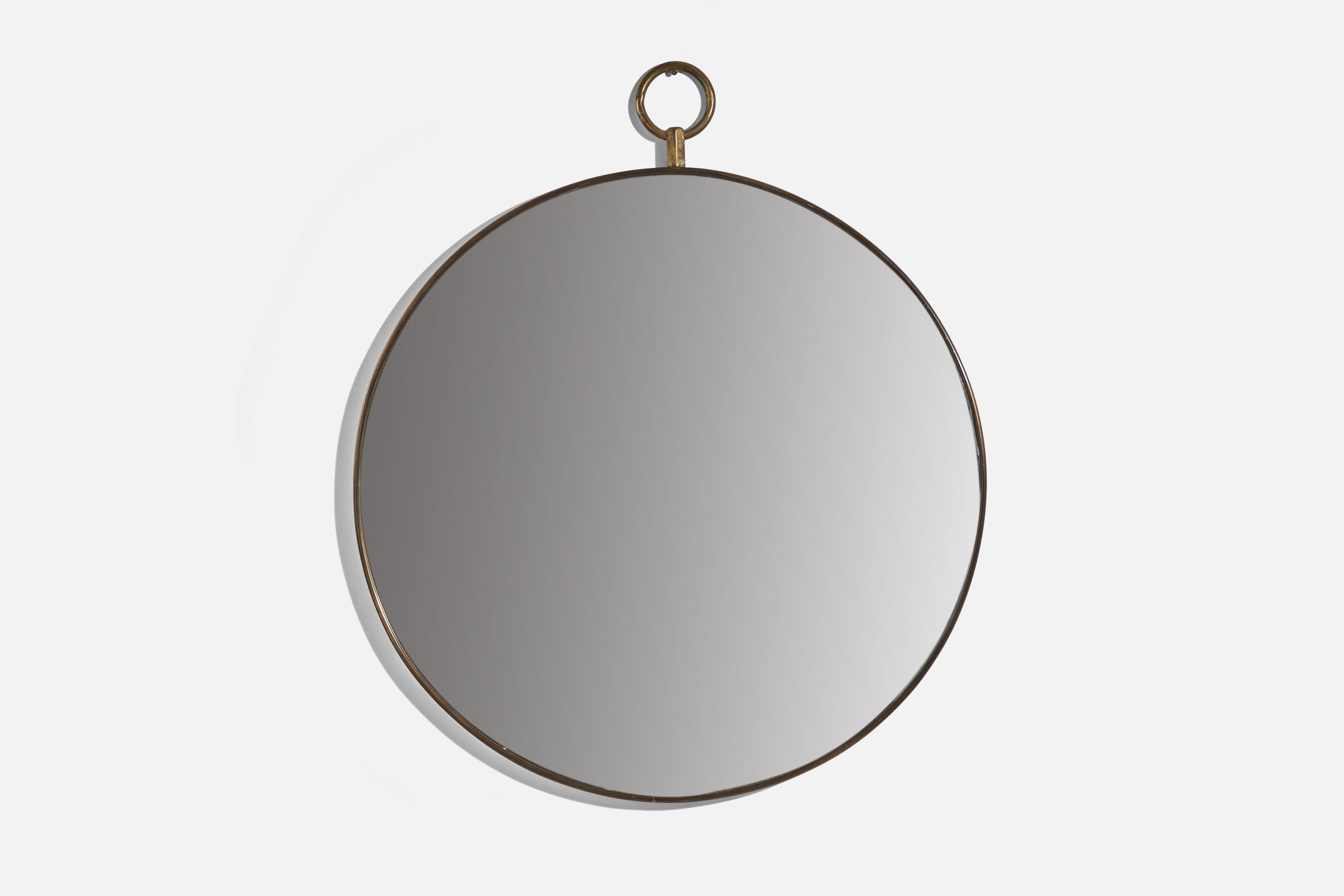 A brass wall mirror designed and produced in Italy, 1950s. 