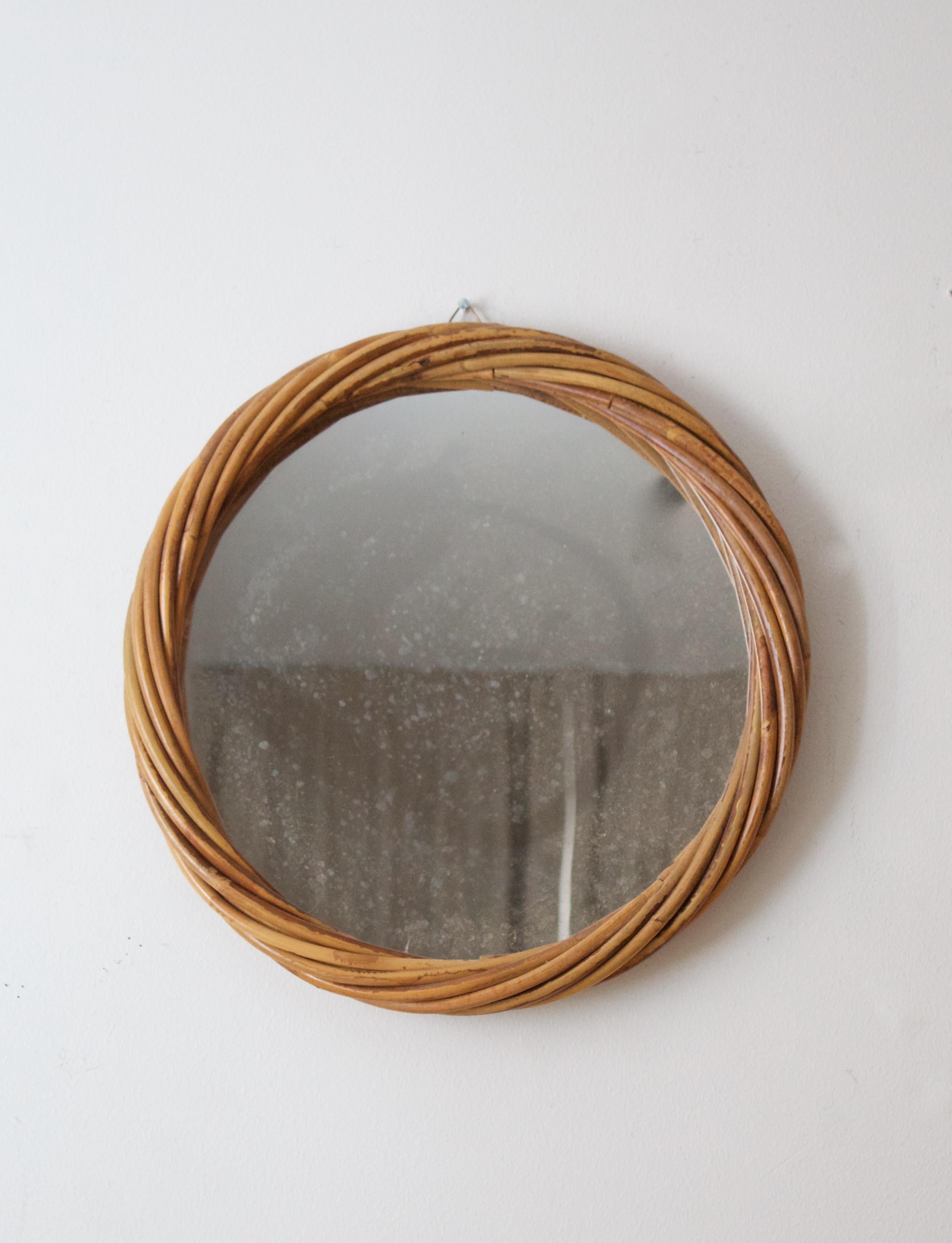 A wall mirror, produced in Italy, 1950s. Cut mirror glass is framed in bamboo and rattan

Other designers of the period include Gio Ponti, Fontana Arte, Max Ingrand, Franco Albini, and Josef Frank.