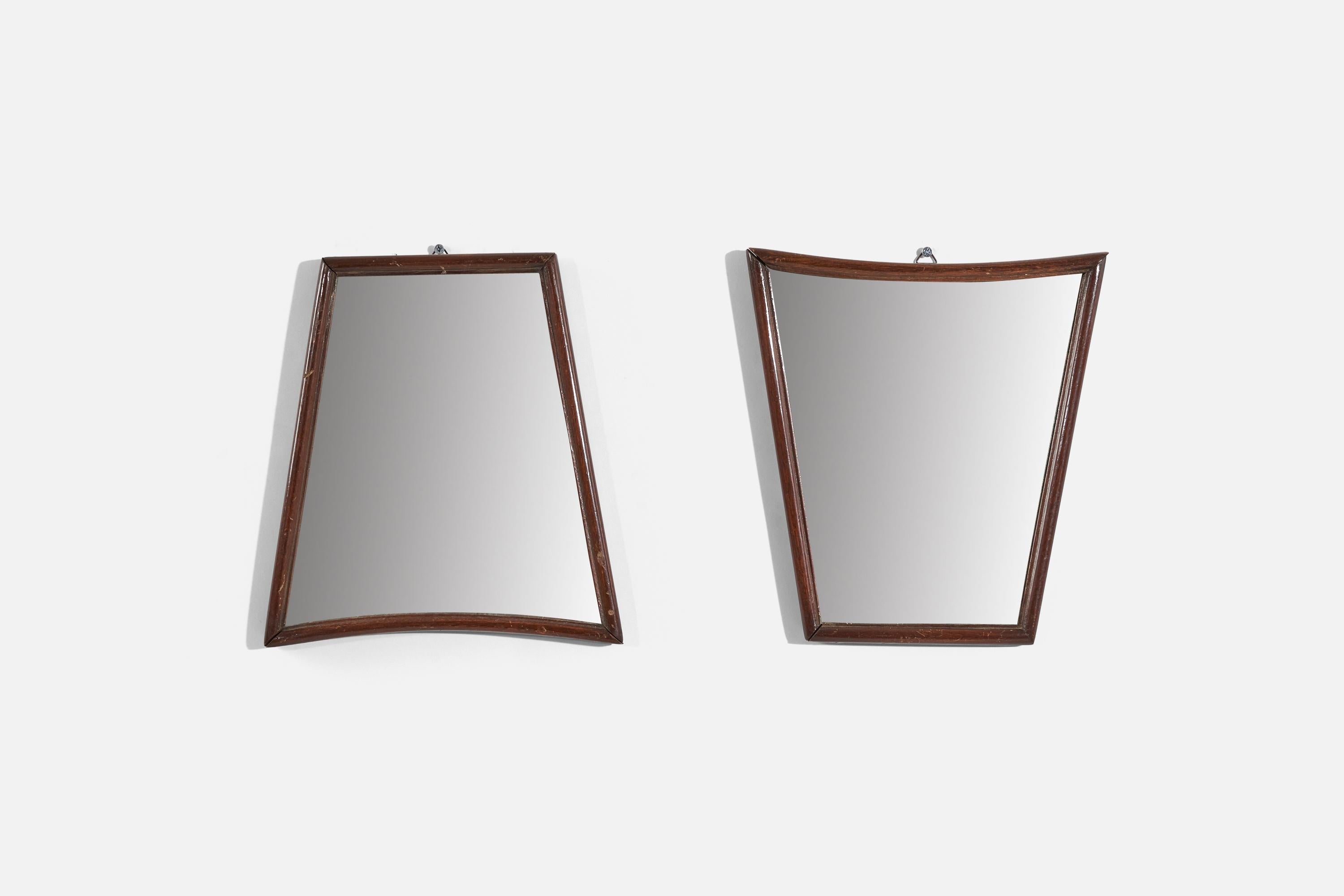 A pair of wall mirrors with walnut frames, produced in Italy, 1940s.
    