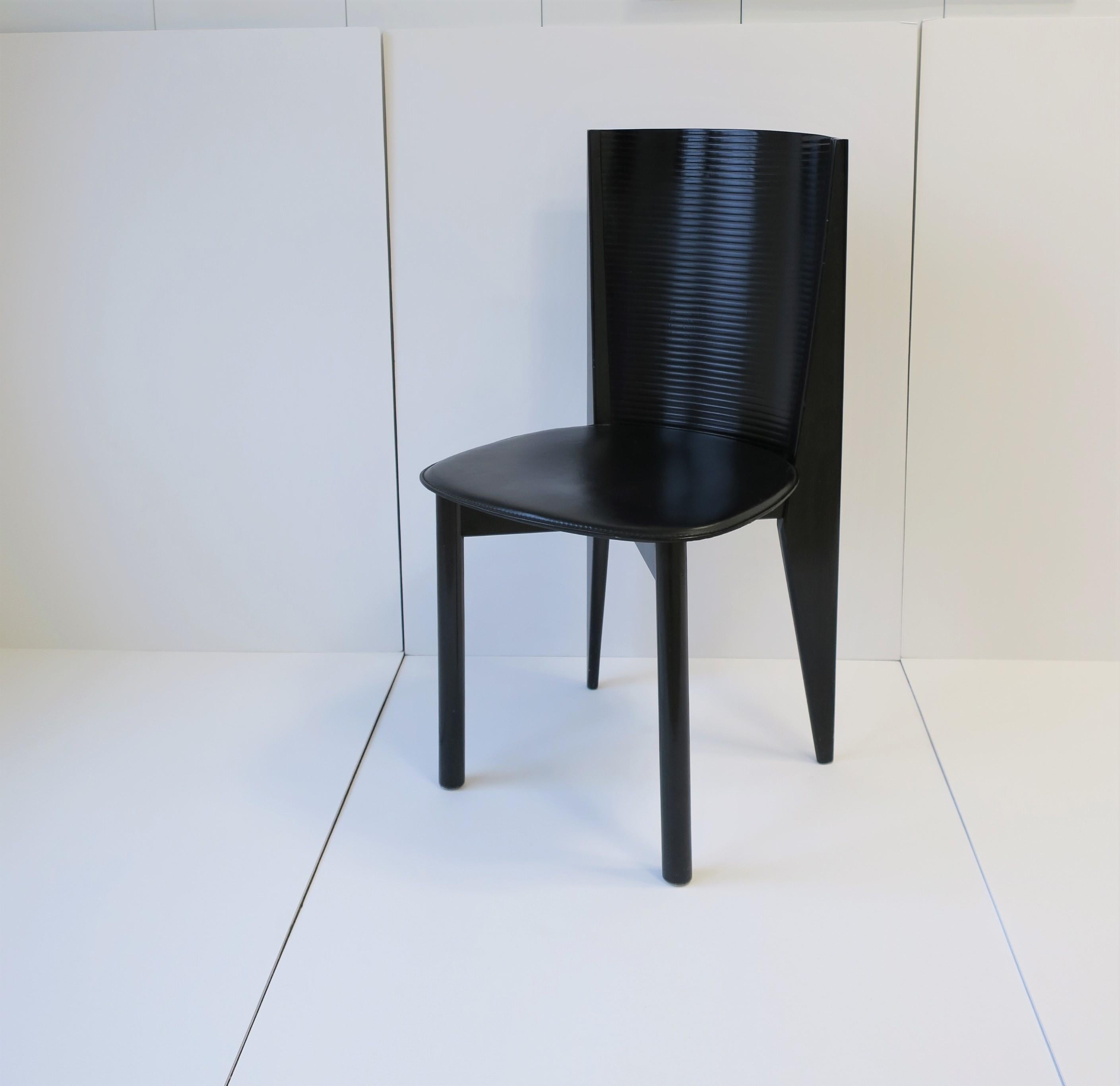 Very beautiful and chic Italian Modern style or Postmodern period black lacquer wood and leather side or desk chair(s), circa late-20th century, late-1970s-1980s, Italy. Beautiful detailing in chair legs and back. With maker's mark on bottom: