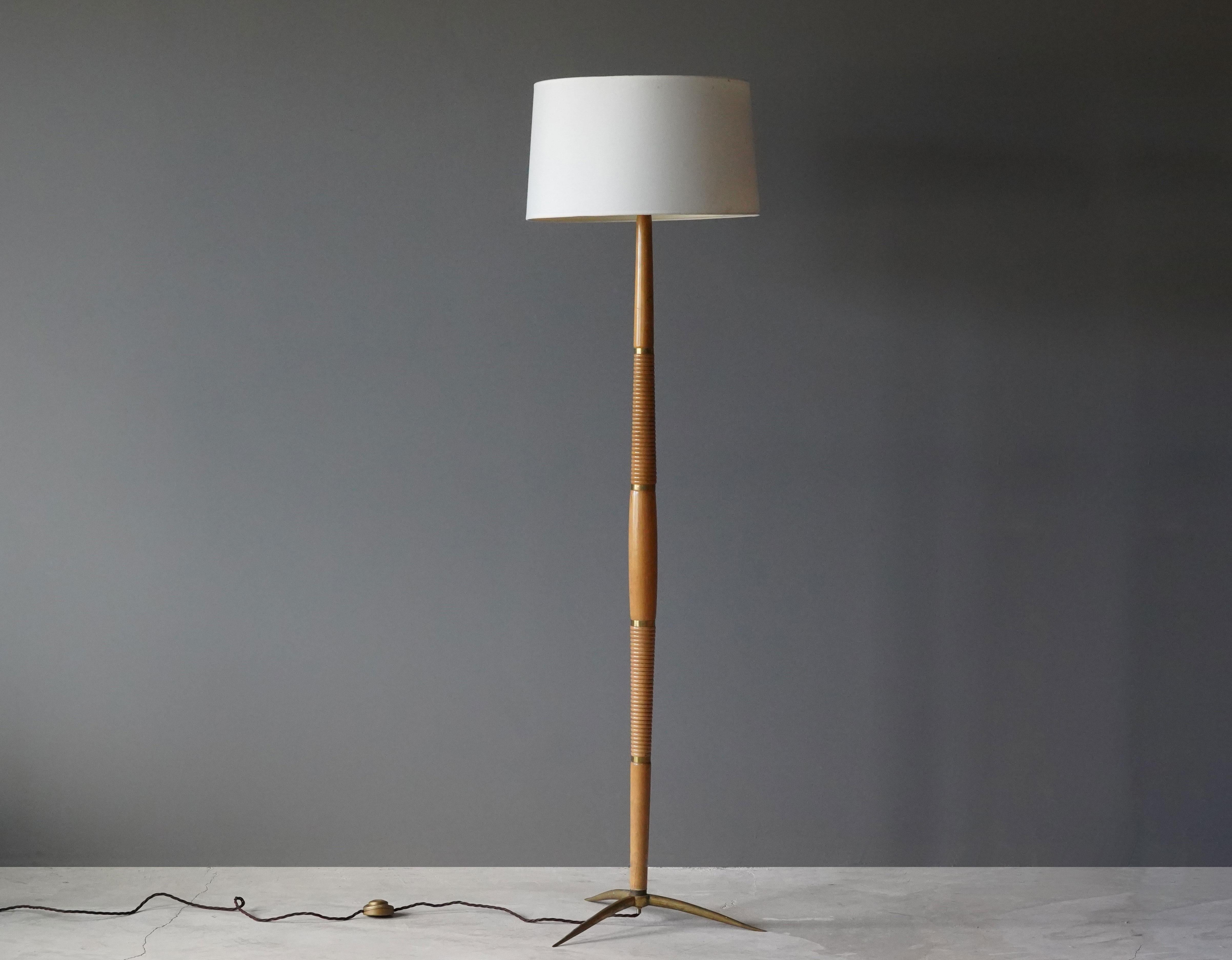 A highly modernist floor lamp. In turned wood on a brass base. Later fabric screen.

Other designers and makers of the period include Angelo Lelii, Max Ingrand, Fontana Arte, Stilnovo, and Gino Sarfatti.