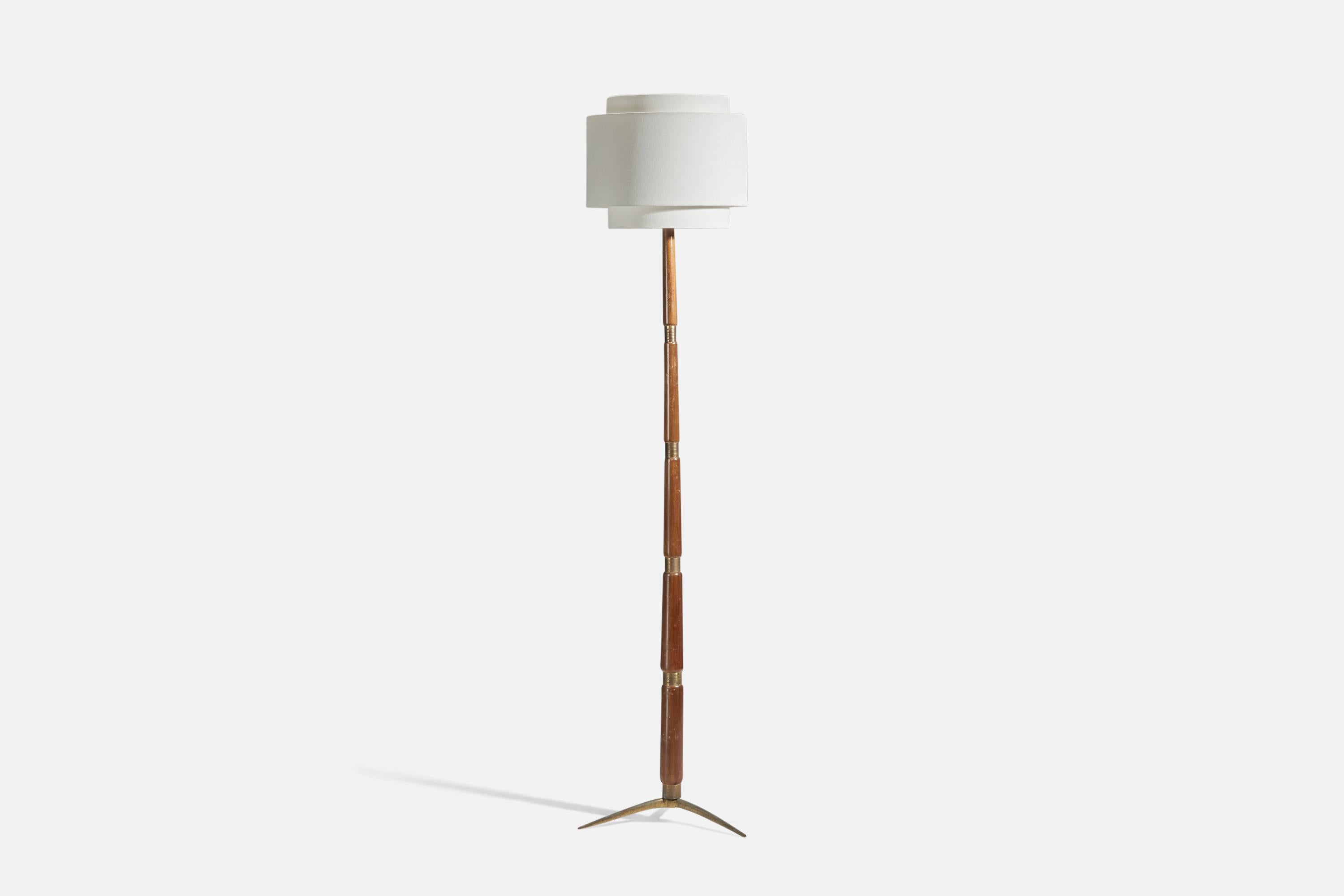 A brass, wood and fabric floor lamp designed and produced in Italy, 1950s.

Sold with Lampshade. Dimensions stated are of Floor Lamp with Lampshade.

Socket takes standard E-26 medium base bulb.

There is no maximum wattage stated on the fixture.
