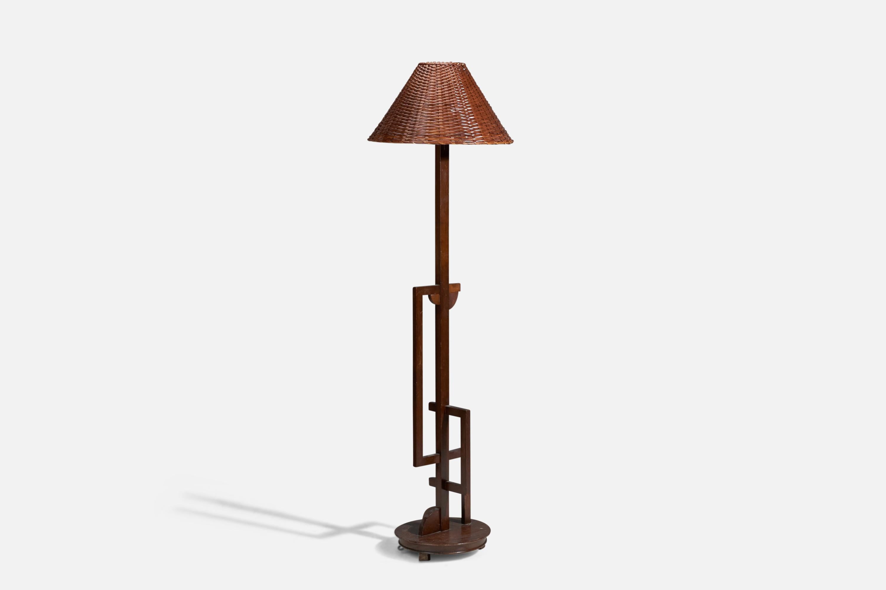 A modernist brass, rosewood, fabric floor lamp designed and produced in Italy, 1940s.

Dimensions stated are of Floor Lamp with Lampshade. 

Socket takes standard E-26 medium base bulb.

There is no maximum wattage stated on the fixture.