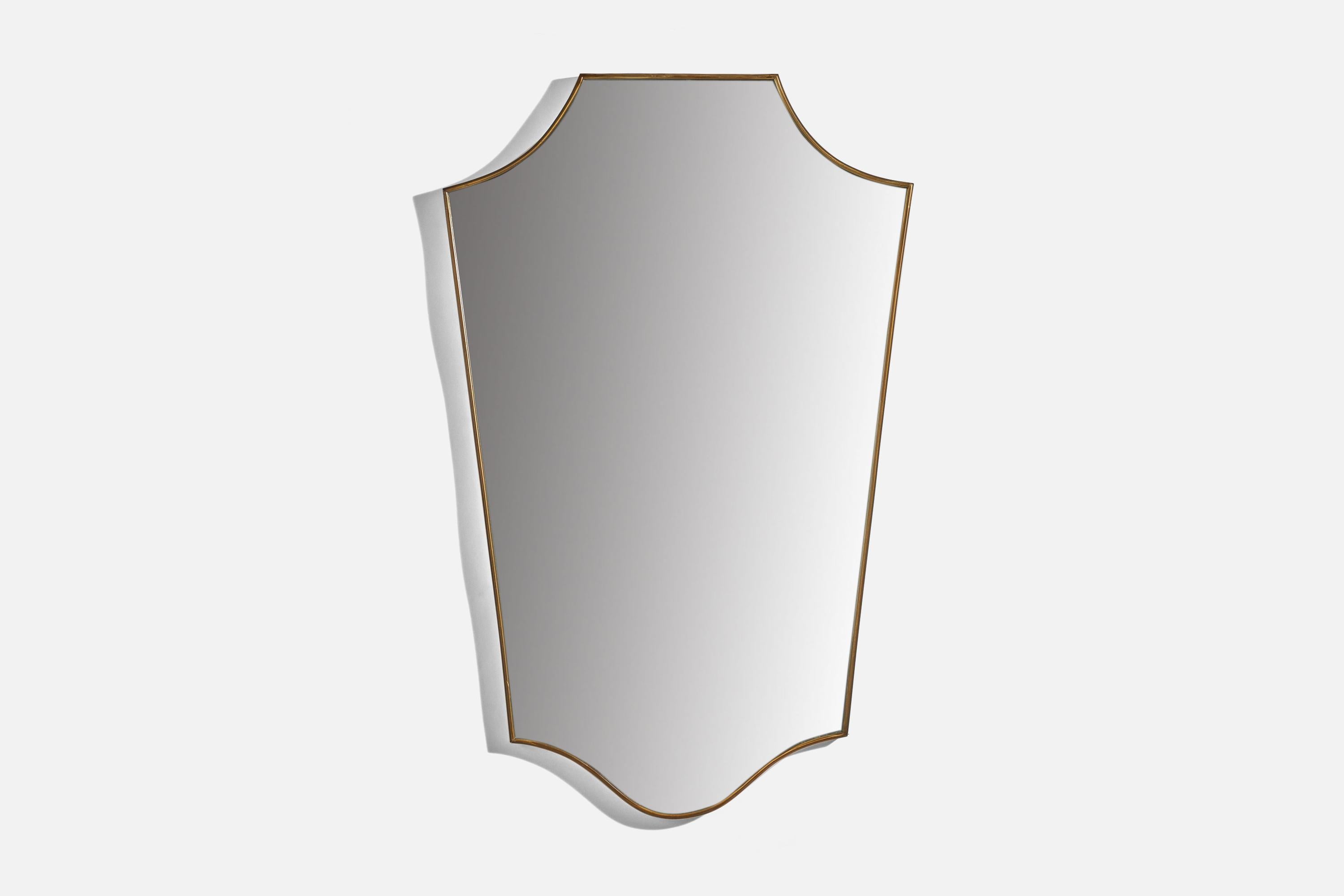 A brass wall mirror designed and produced in Italy, 1950s. 