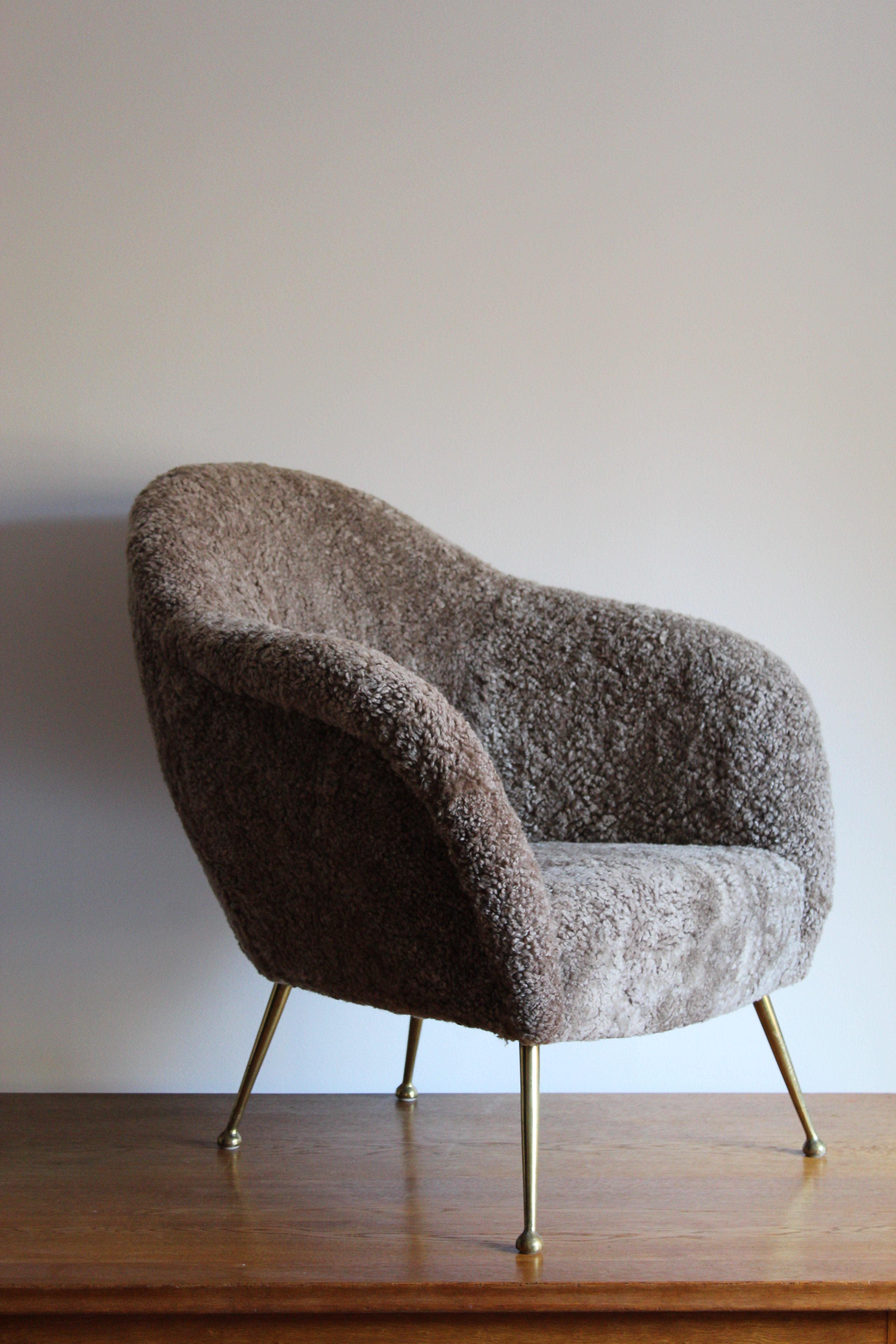 A organic modernist lounge chair. Produced in Italy, 1950s. Newly reupholstered in brand new authentic sheepskin upholstery.

Other designers of the period include Federico Munari, Guglielmo Veronesi, Gio Ponti, Ico Parisi, and Franco Albini.