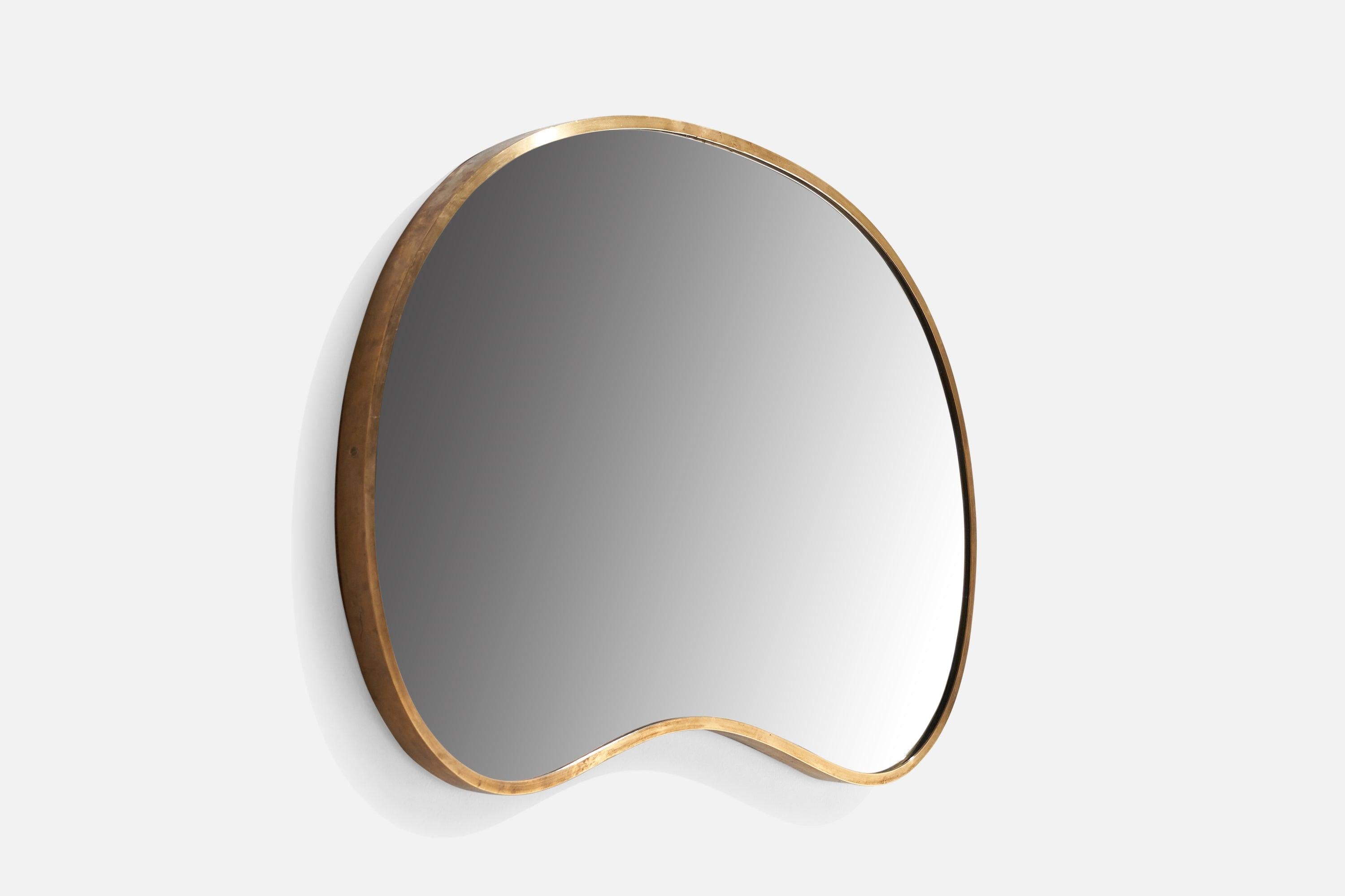 An organic brass wall mirror designed and produced in Italy, c. 1940s.