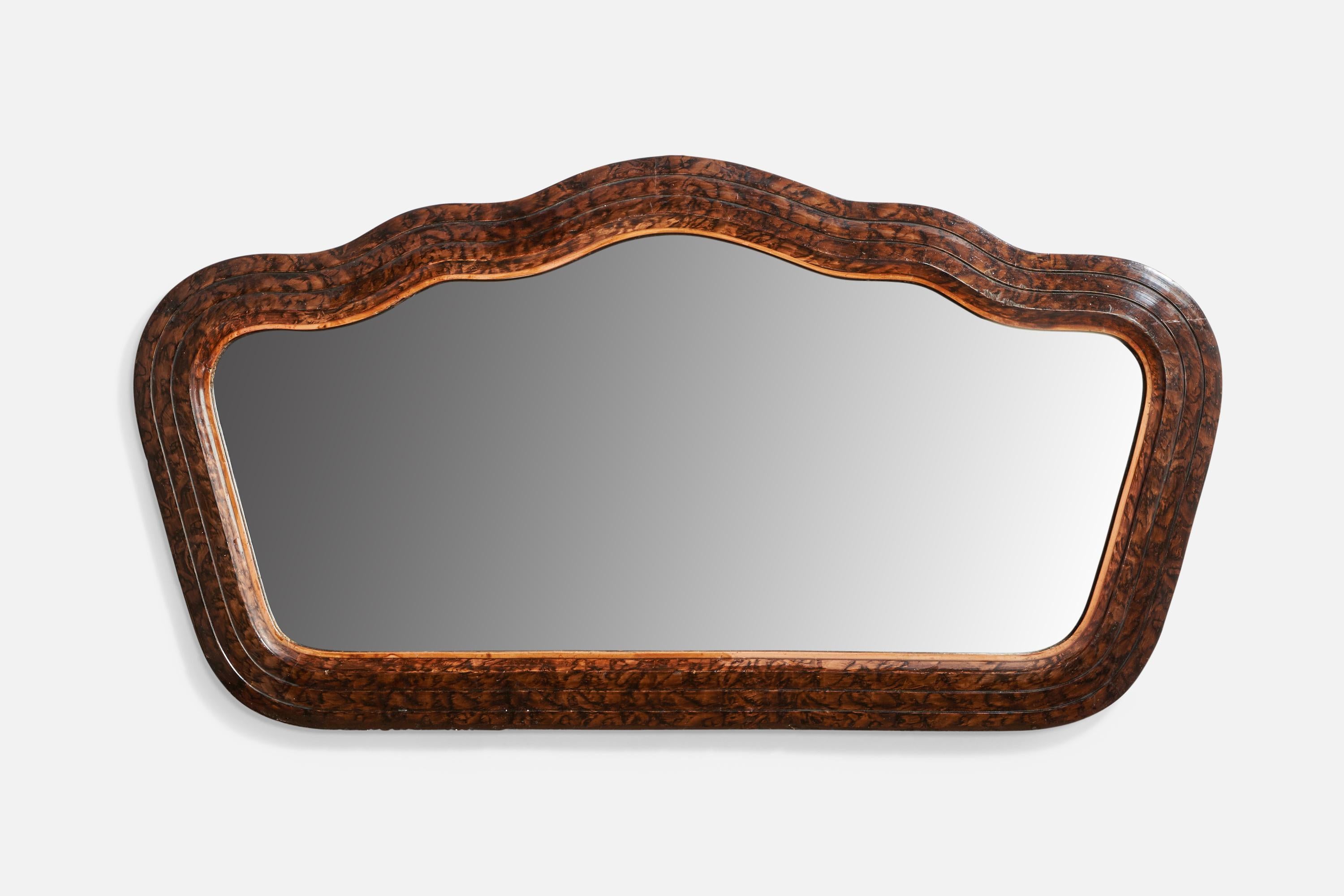 An organic dark-stained burl wood wall mirror designed and produced in Italy, c. 1930s.