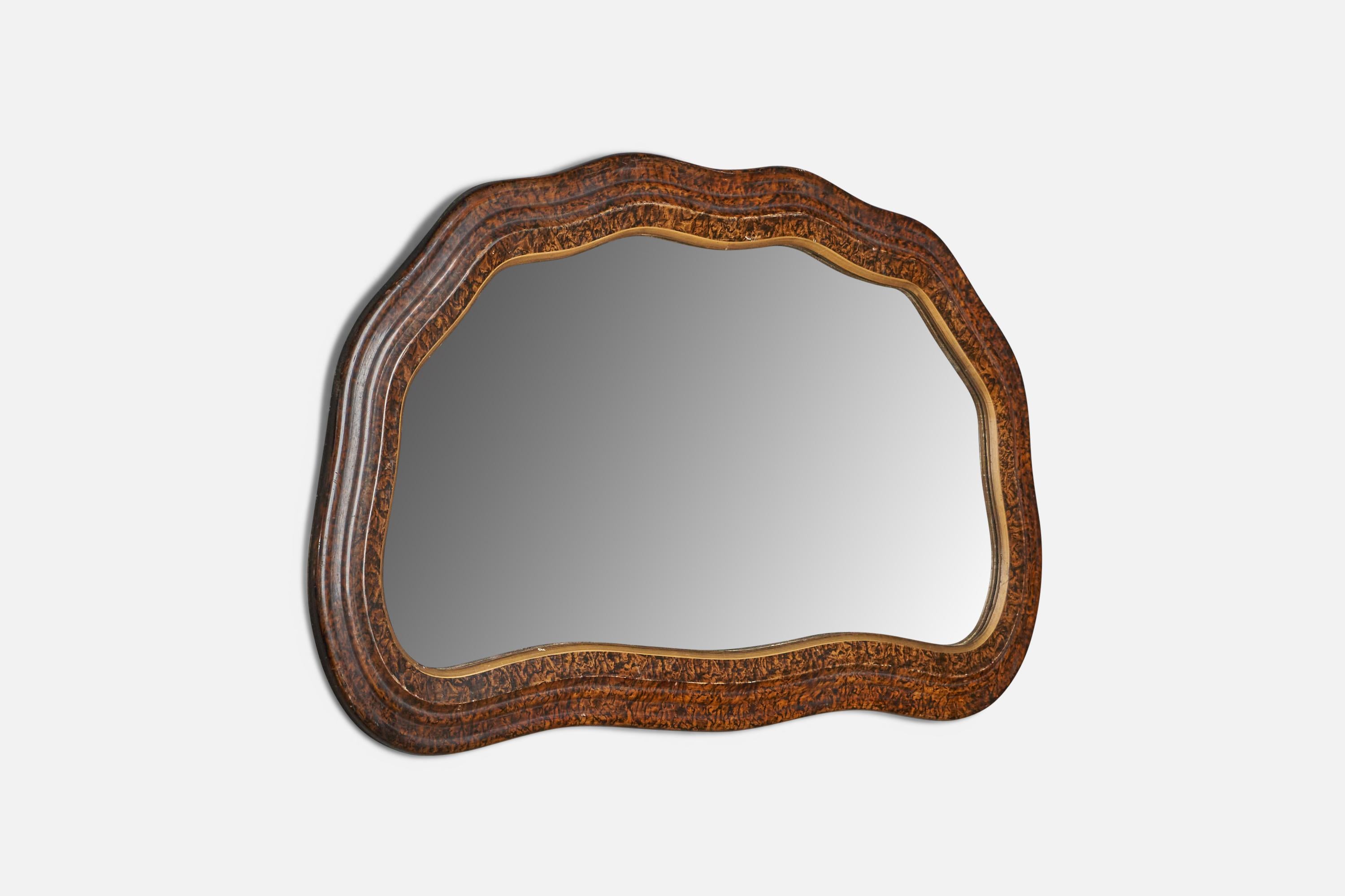 An organic burl wood wall mirror designed and produced in Italy, 1930s.