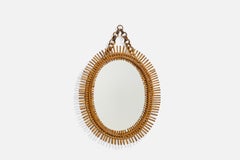 Diseñador italiano, Espejo de pared ovalado, ratán, cristal de espejo, Italia, c. 1950