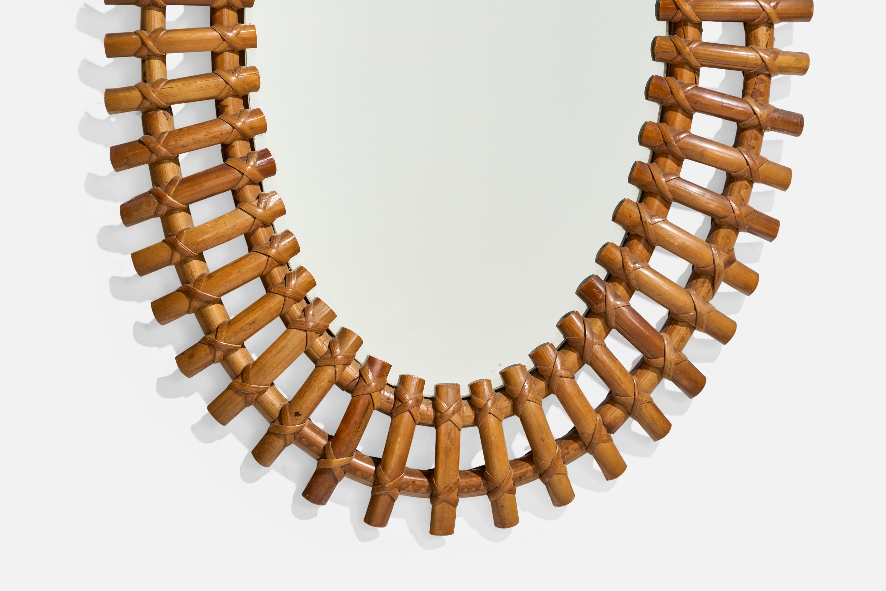 Diseñador italiano, Espejo de pared ovalado, ratán, cristal de espejo, Italia, c. 1950 mediados del siglo XX en venta