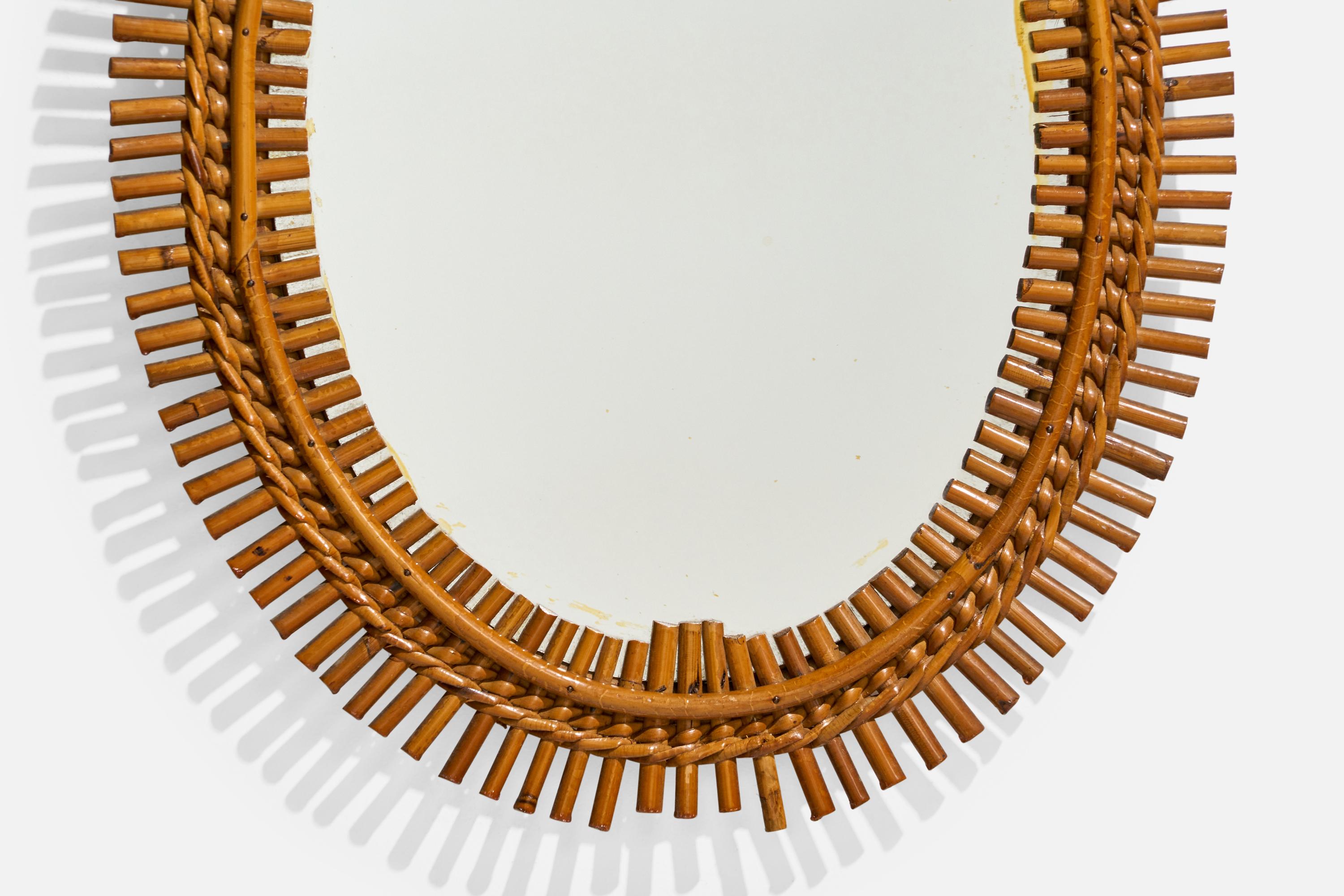 Diseñador italiano, Espejo de pared ovalado, ratán, cristal de espejo, Italia, S. 1950 Ratán en venta