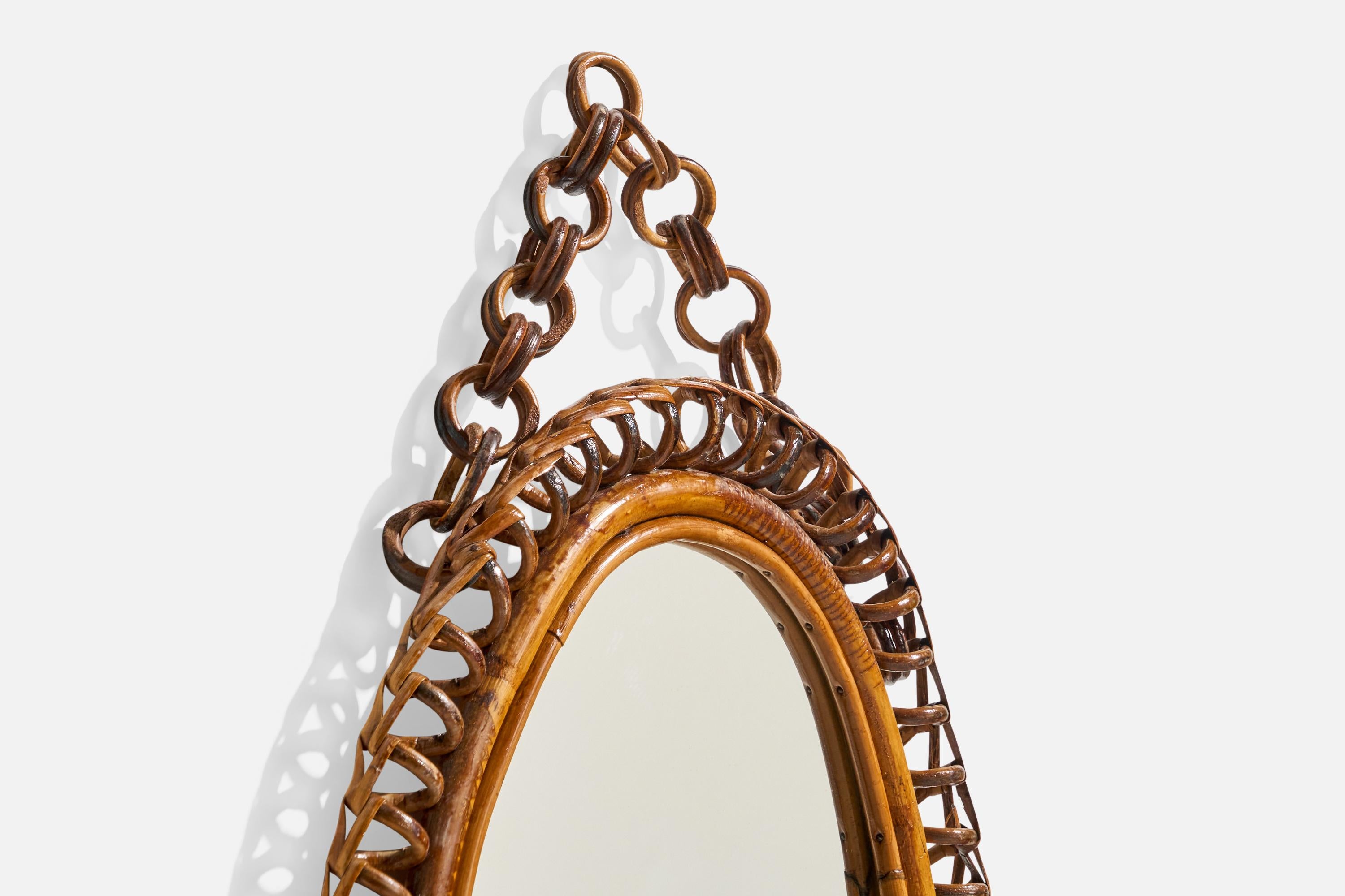 Specchio da parete ovale di design italiano, rattan, vetro a specchio, Italia, anni '50 circa In condizioni buone in vendita a High Point, NC