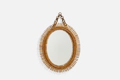 Italienischer italienischer Designer, ovaler Wandspiegel, Rattan, Spiegelglas, Italien, ca. 1950er Jahre