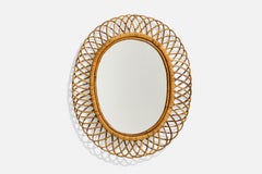 Italienischer italienischer Designer, ovaler Wandspiegel, Rattan, Spiegelglas, Italien, ca. 1950er Jahre