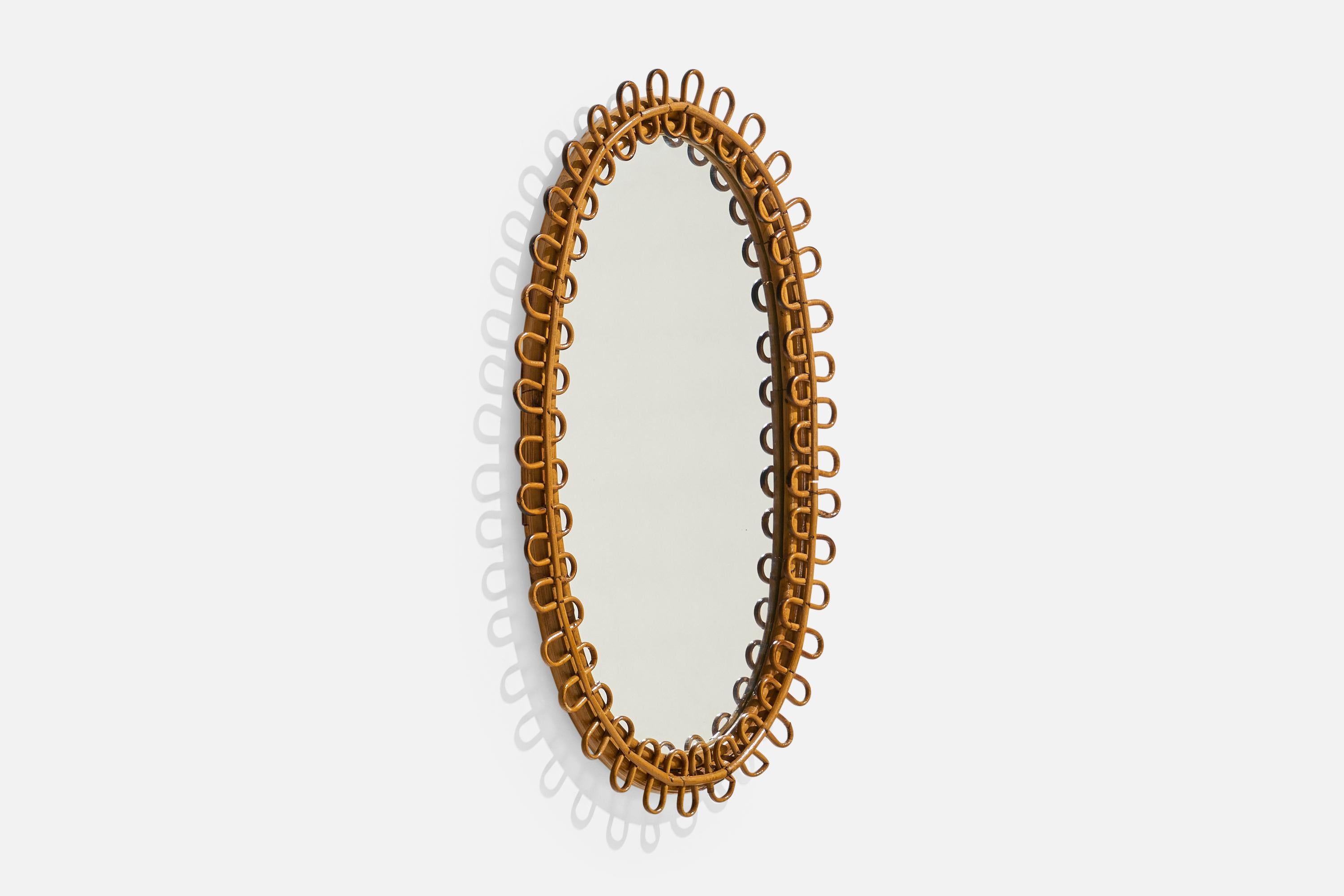 Mid-Century Modern Designer italien, miroir mural ovale, rotin, miroir, Italie, c.C. 1950s en vente