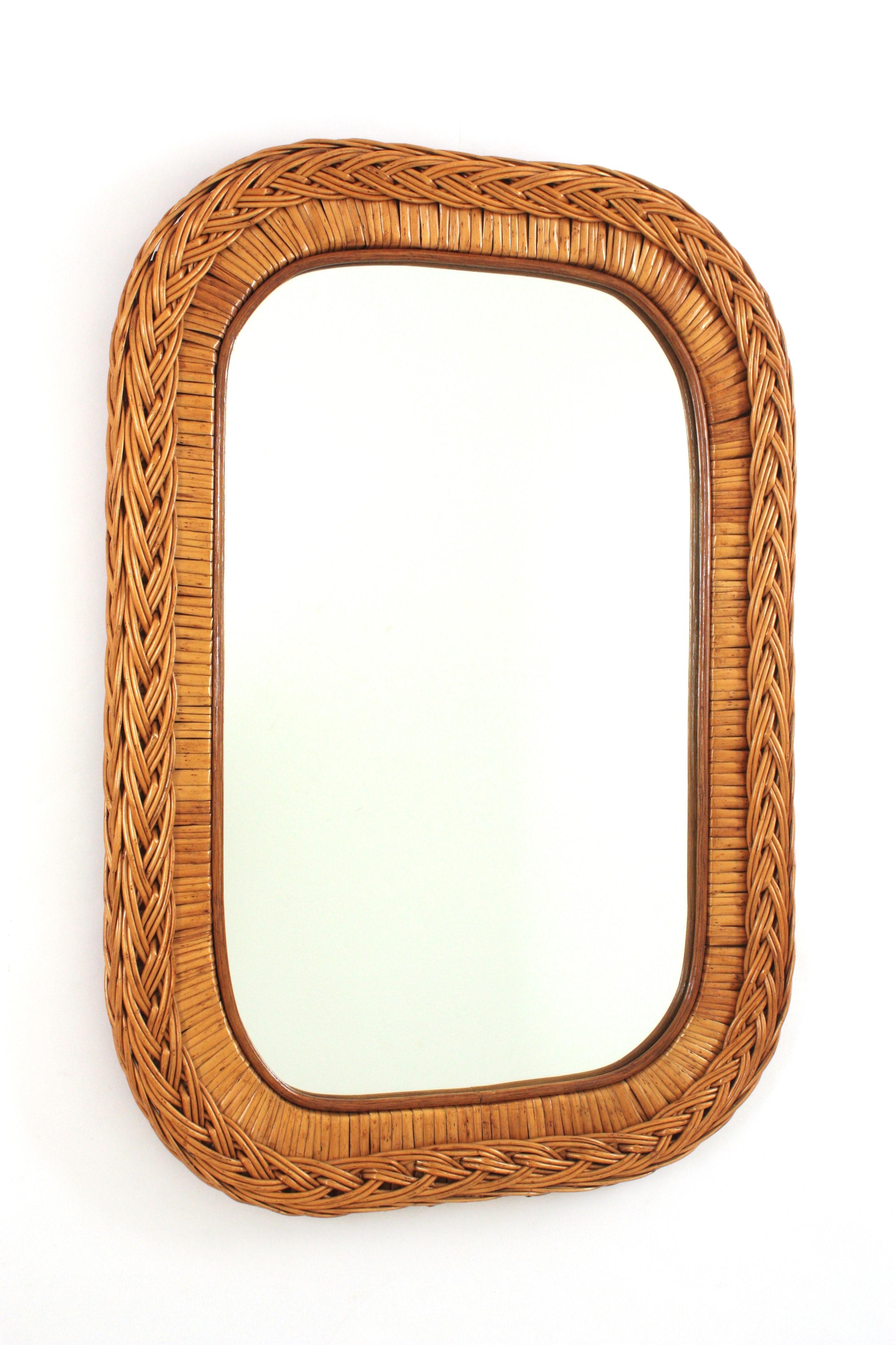 Rectangular Rattan and Woven Wicker Mirror. Italy, 1960s
Beautiful wall mirror with woven wicker braided rectangular shaped frame and rounded corners.
It will be a nice addition to be used in a bathroom or as wall mirror / console mirror in any