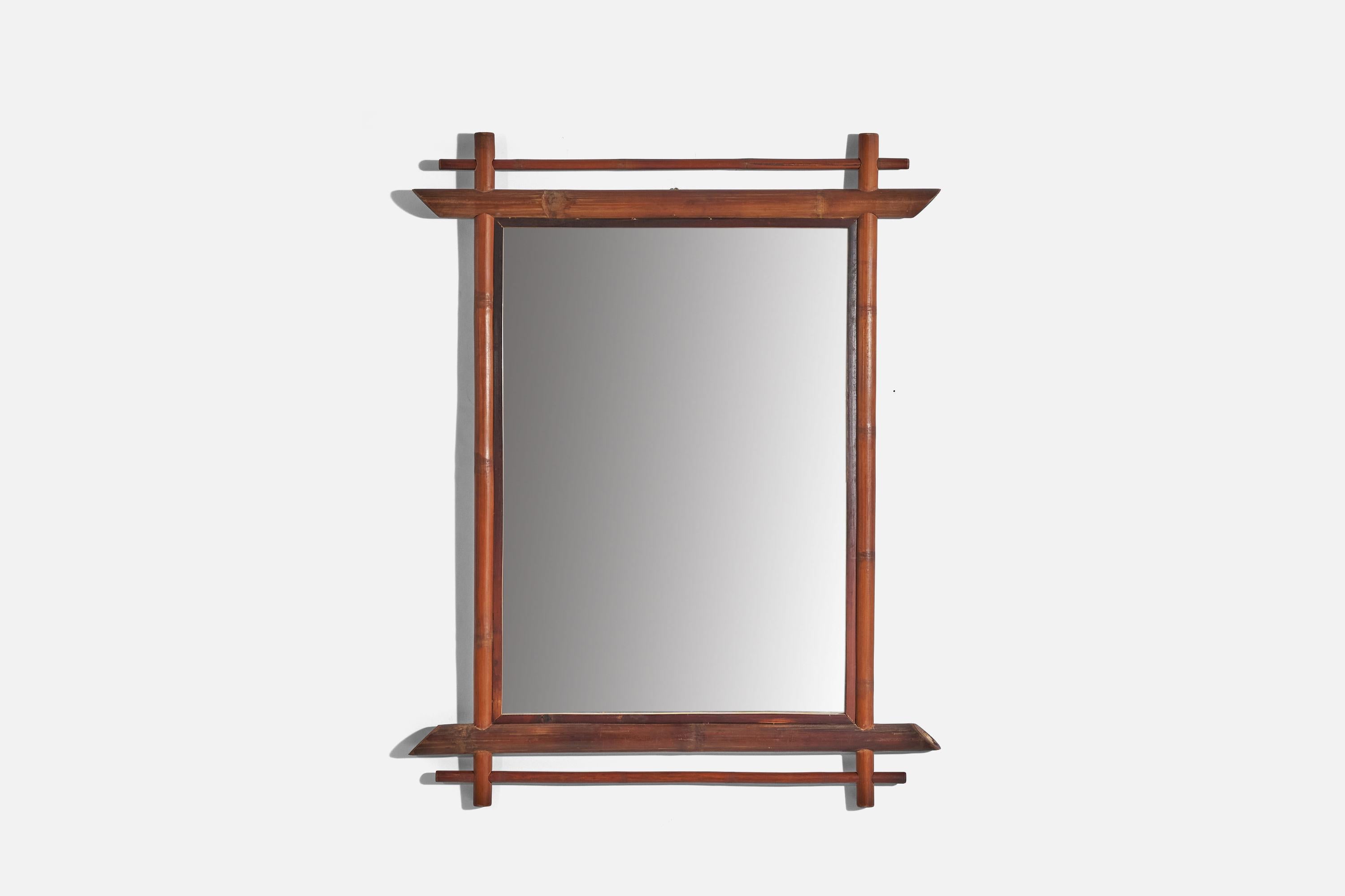 A rectangular, bamboo wall mirror designed and produced in Italy, 1960s.
  