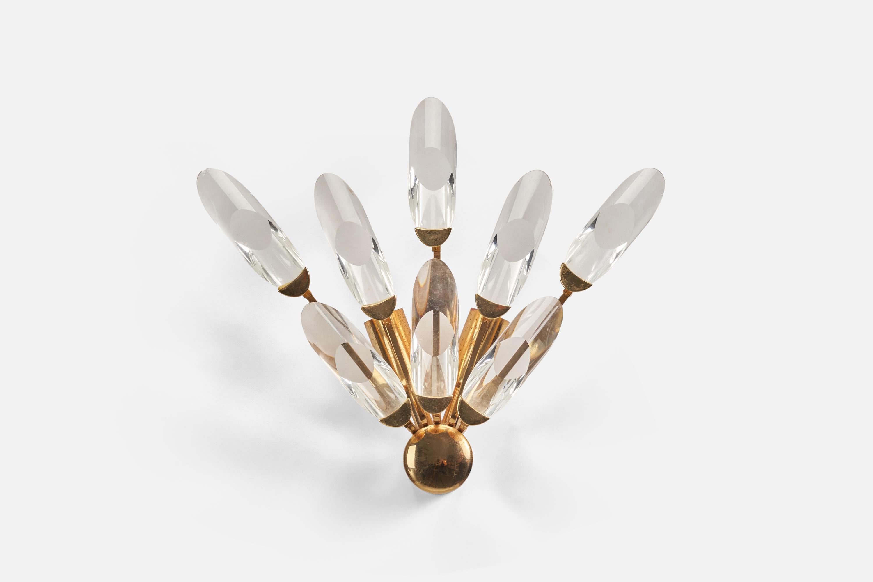 A brass and glass sconce designed and produced in Italy, 1980s. 

Dimensions of Back Plate (inches) : 1.96 x 1.96 x 2.85 (Height x Width x Depth)

Sockets take E-14 bulbs.

There is no maximum wattage stated on the fixture.