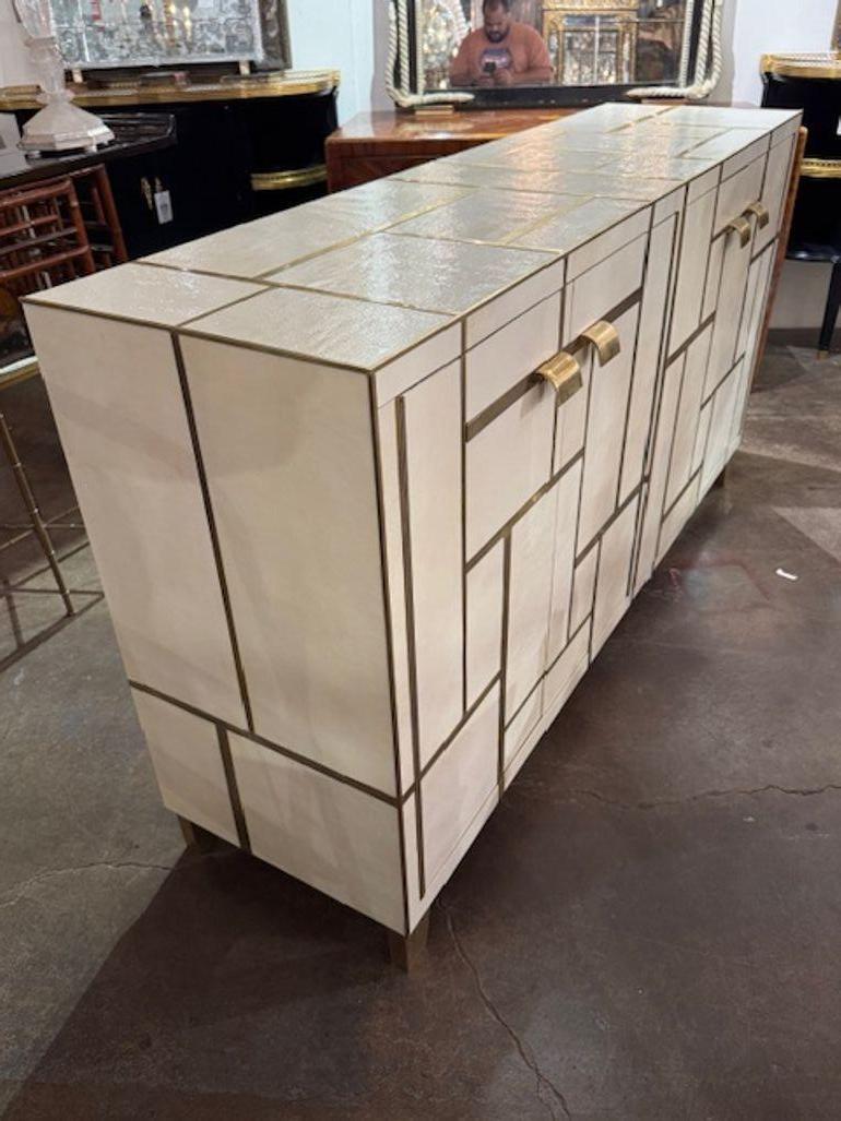 Vintage Italian designer textural side cabinet with geometric brass inlay. This is a stunning piece in person. Circa 1960. 66.5w x 18d x 35.5h