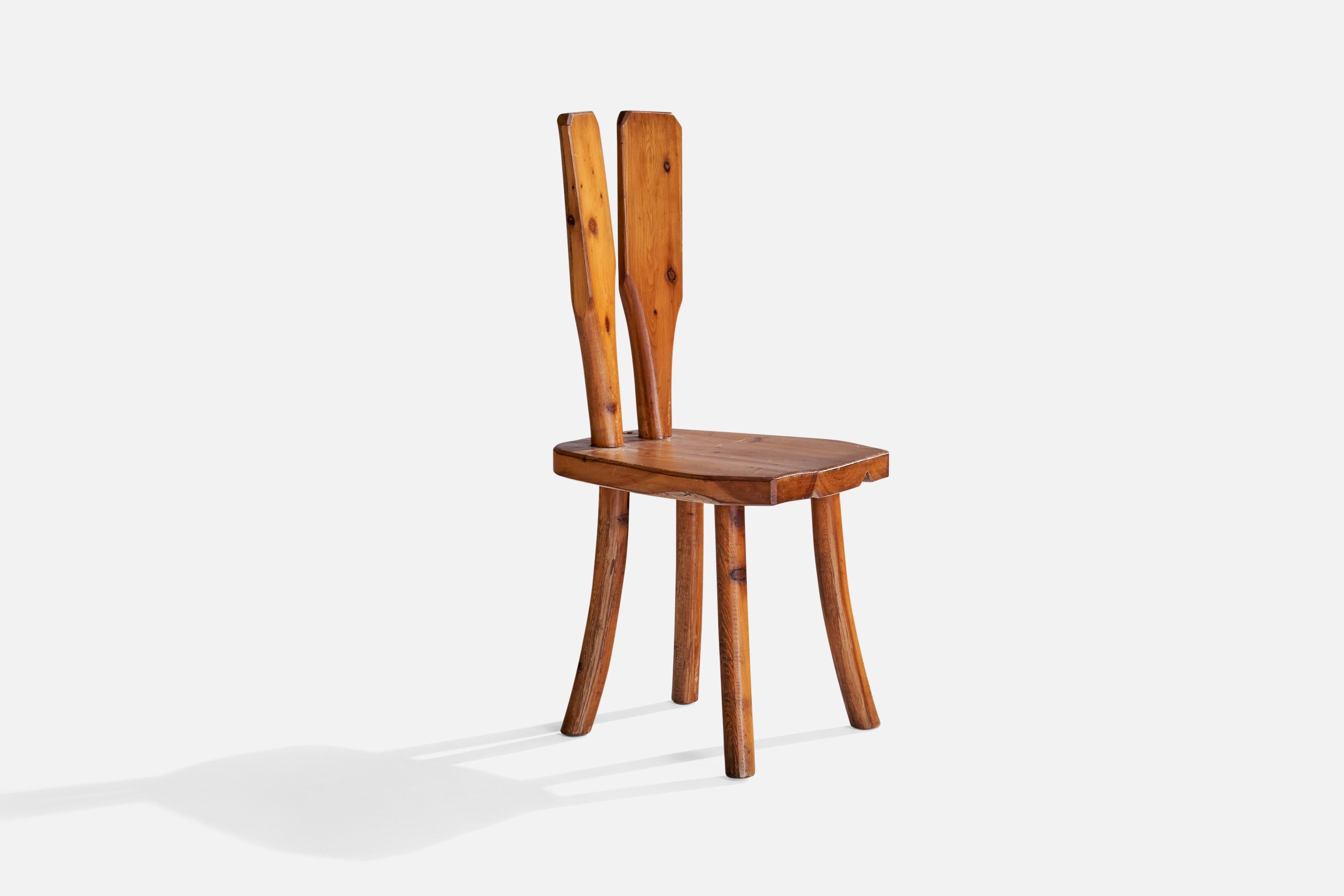 A pine side chair designed and produced in Italy, 1950s.

Seat height 17.75”.