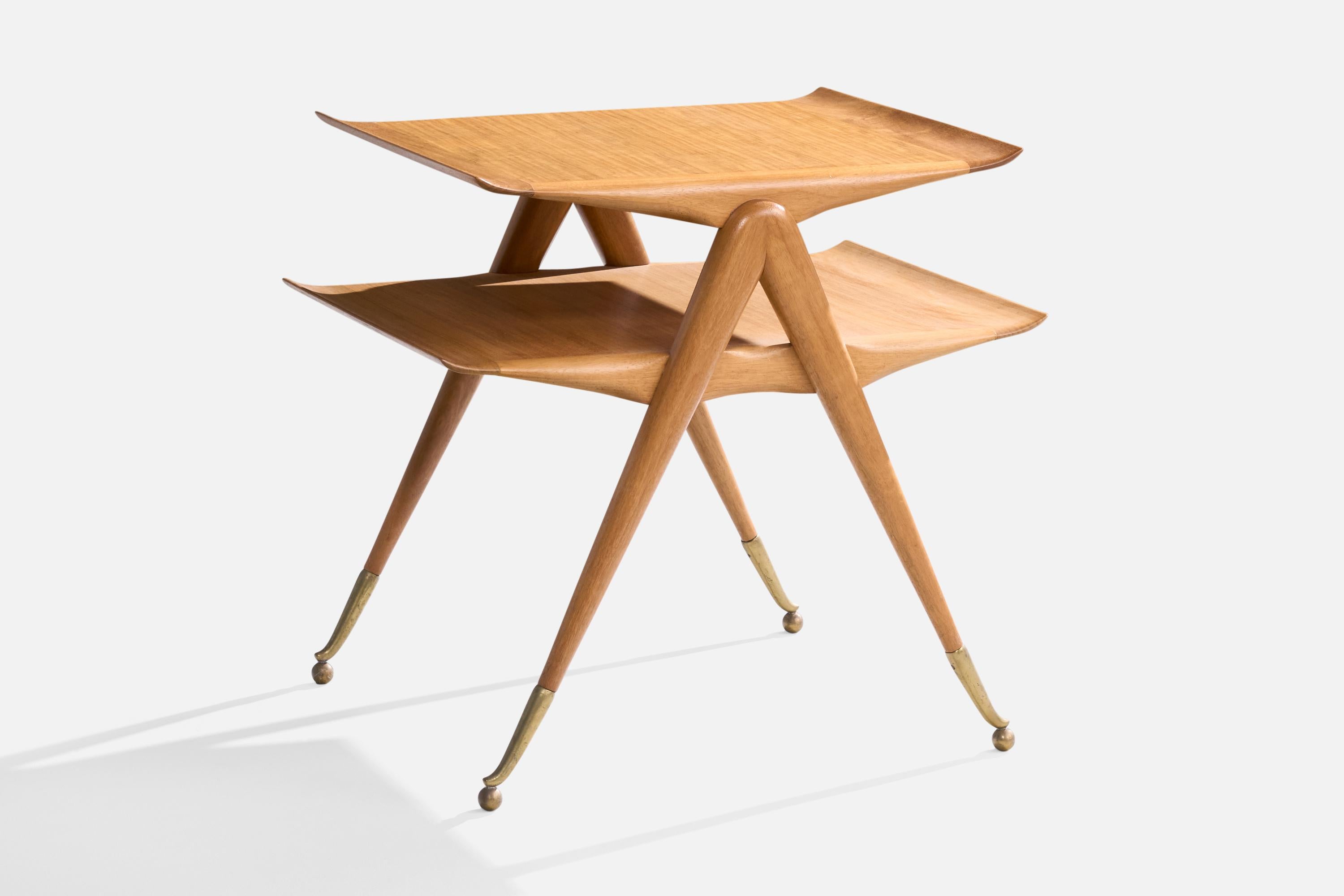 A wood and brass side table likely designed and produced in Italy, c. 1950s.

Light staining on top surface.

Dimensions: 24.75” H x 26.125” W x 20.5” D