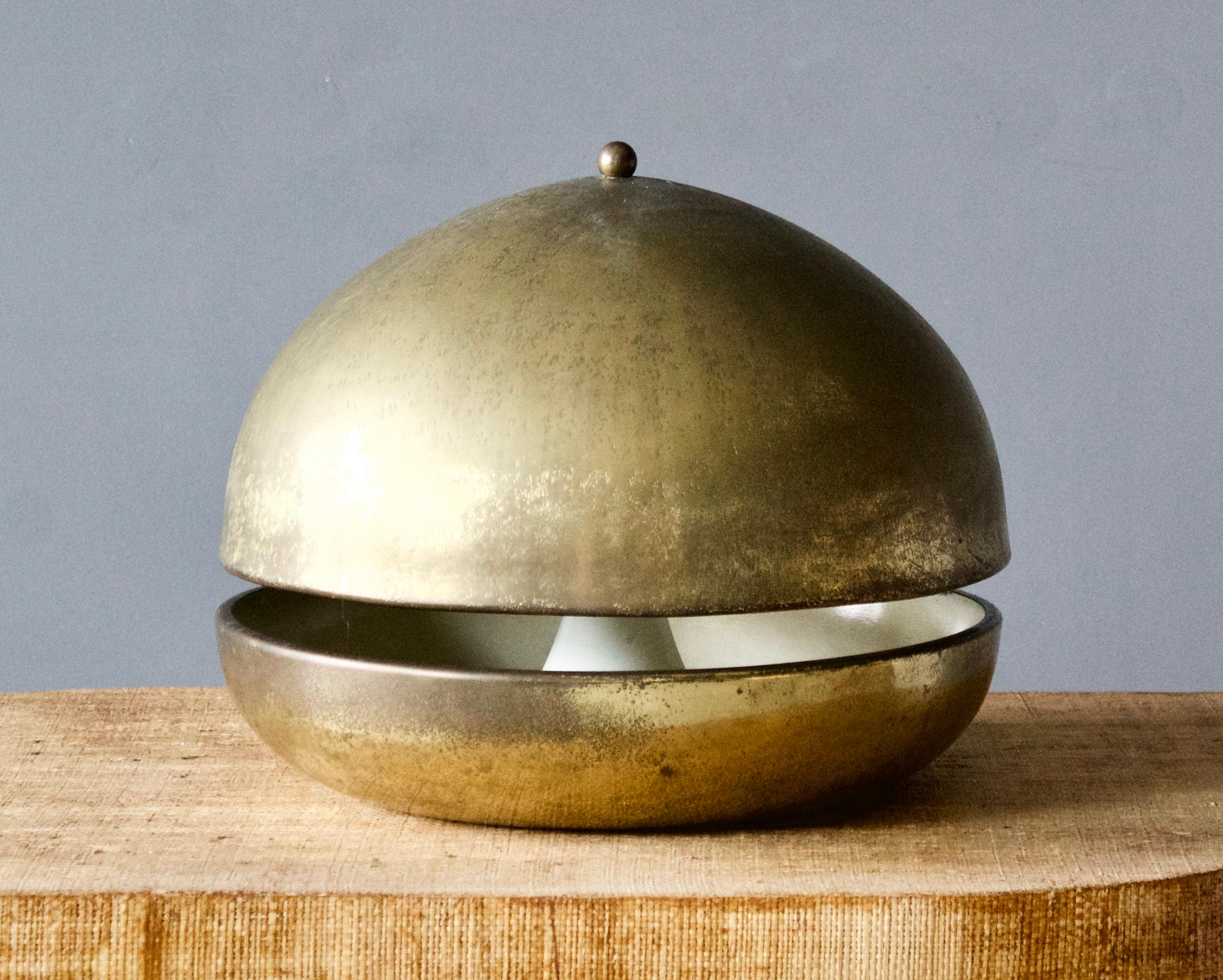 A sizable table lamp, produced in Italy, 1970s. Brass.

Other designers of the period include Gio Ponti, Fontana Arte, Max Ingrand, Franco Albini, and Josef Frank.