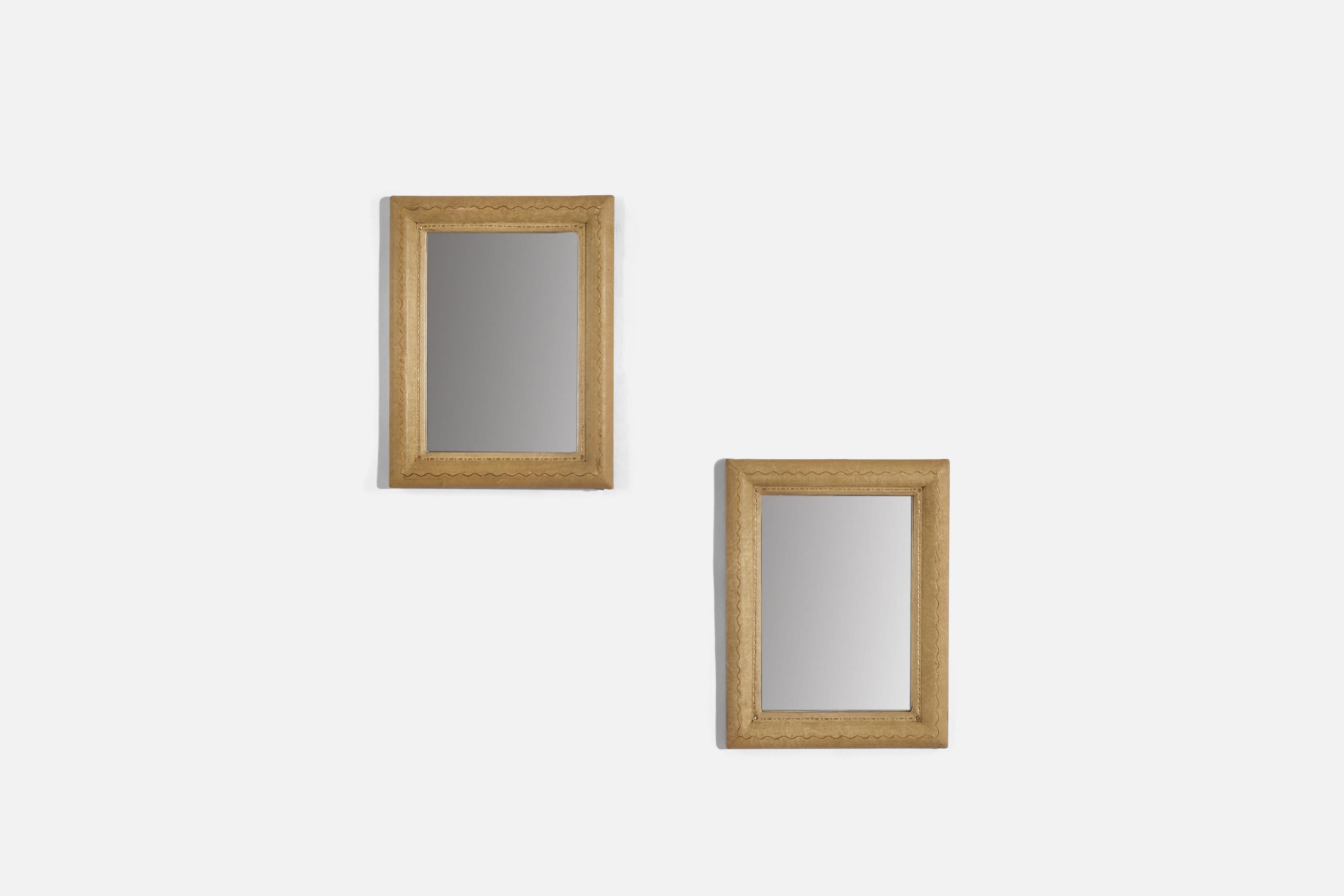A pair of small shagreen wall mirrors designed and produced by an Italian designer, Italy, 1930s.
 