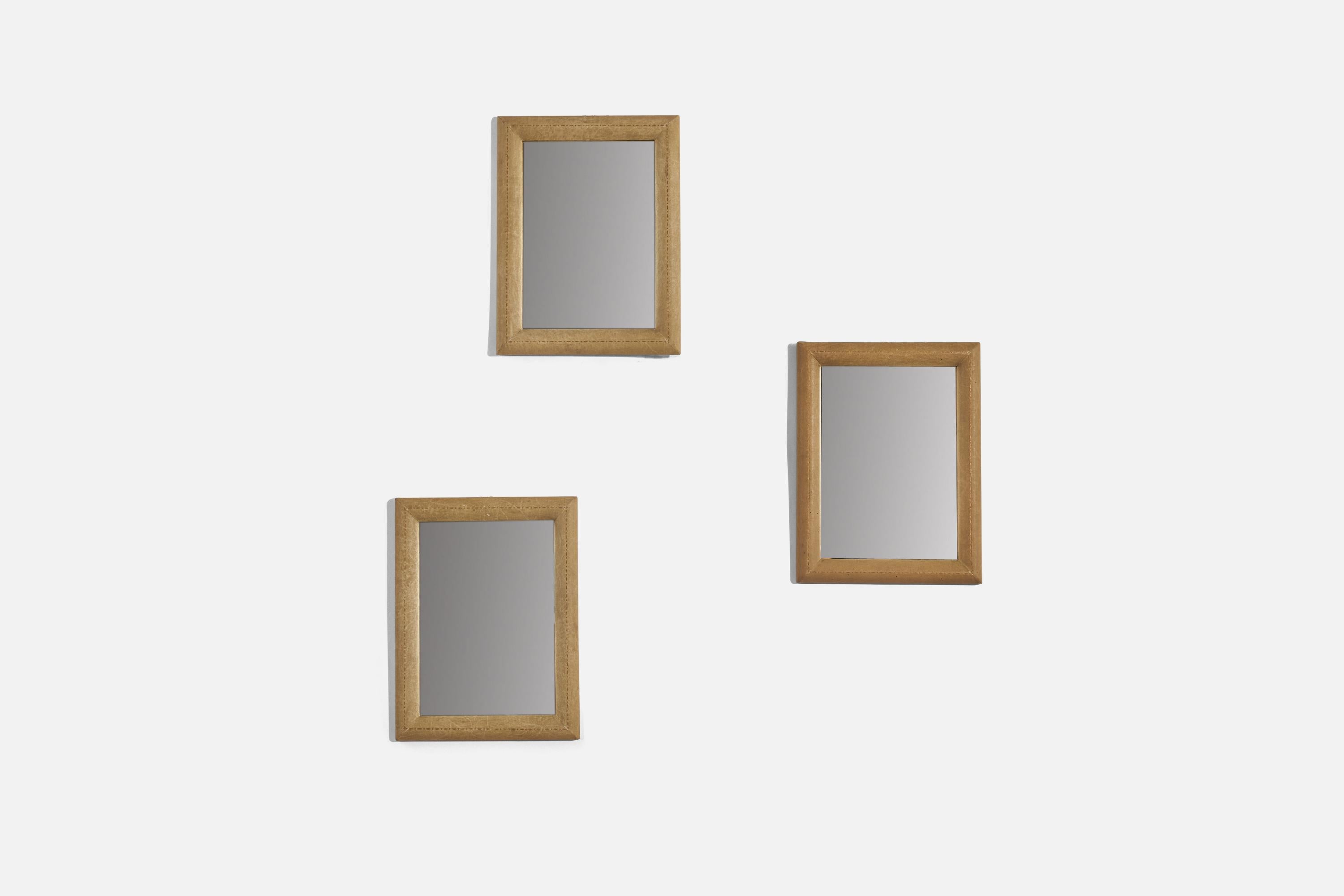 A set of 3 small shagreen wall mirrors designed and produced by an Italian designer, Italy, 1930s.
 