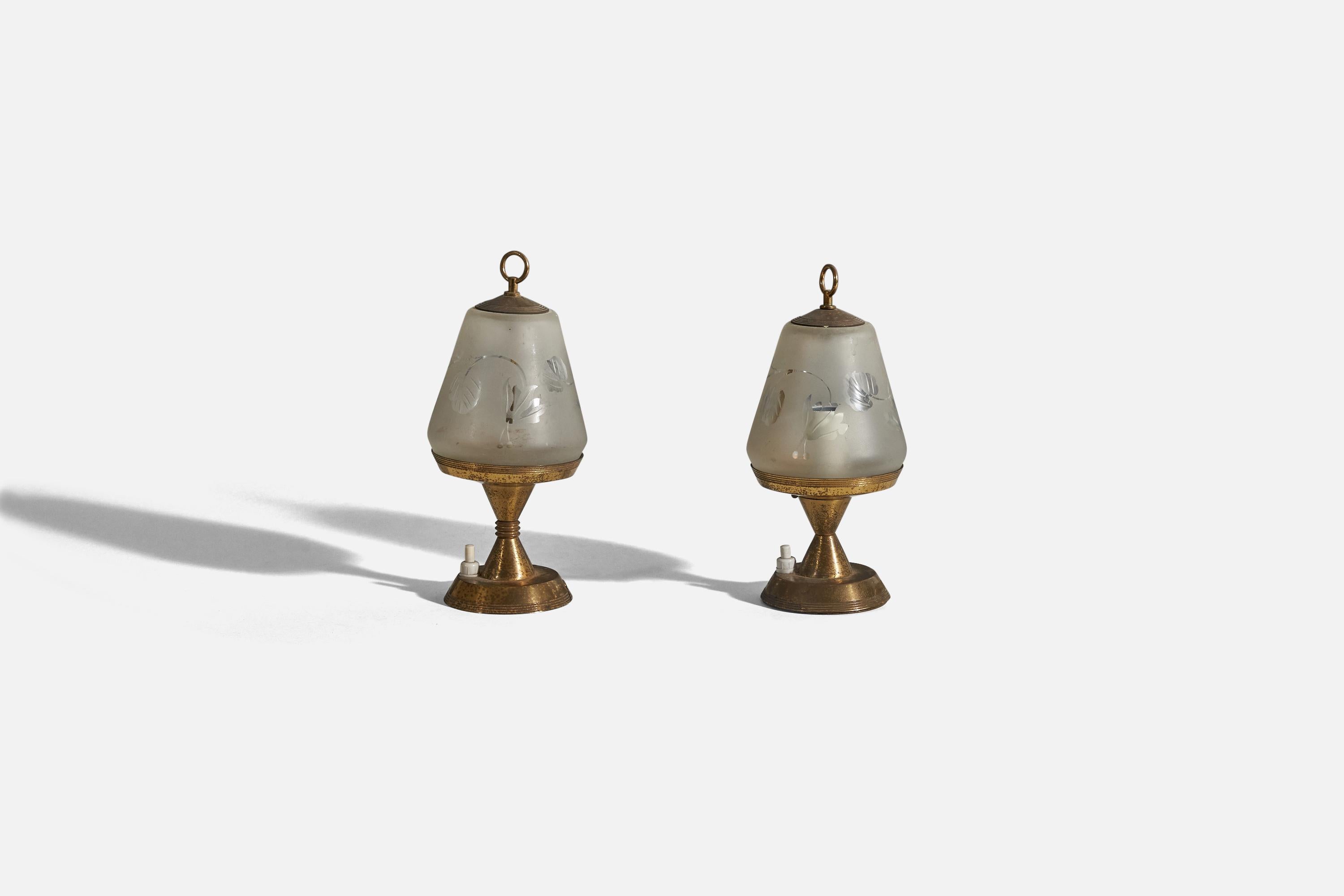 A pair of brass and glass table lamps designed and produced in Italy, 1940s. 

