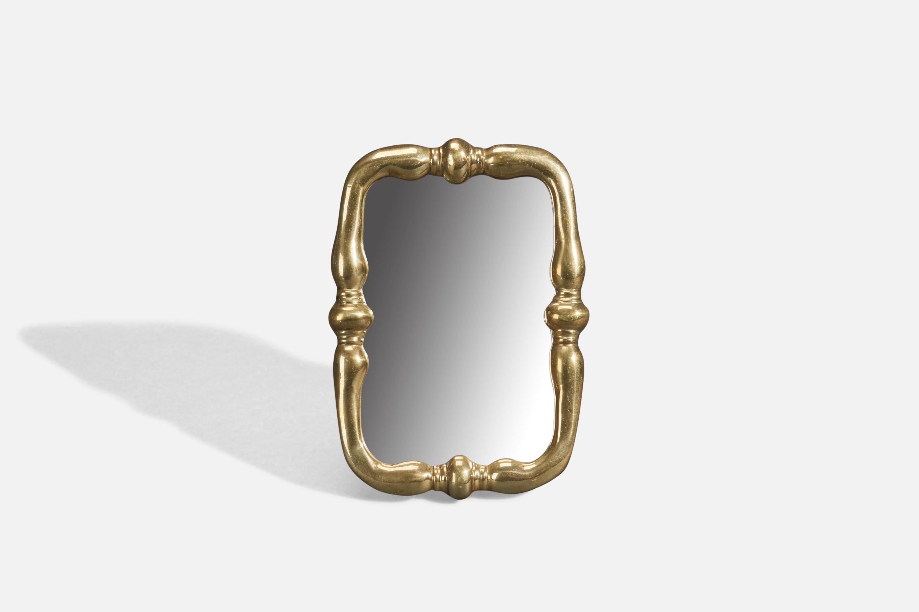 A brass table mirror designed and produced in Italy, 1940s. 