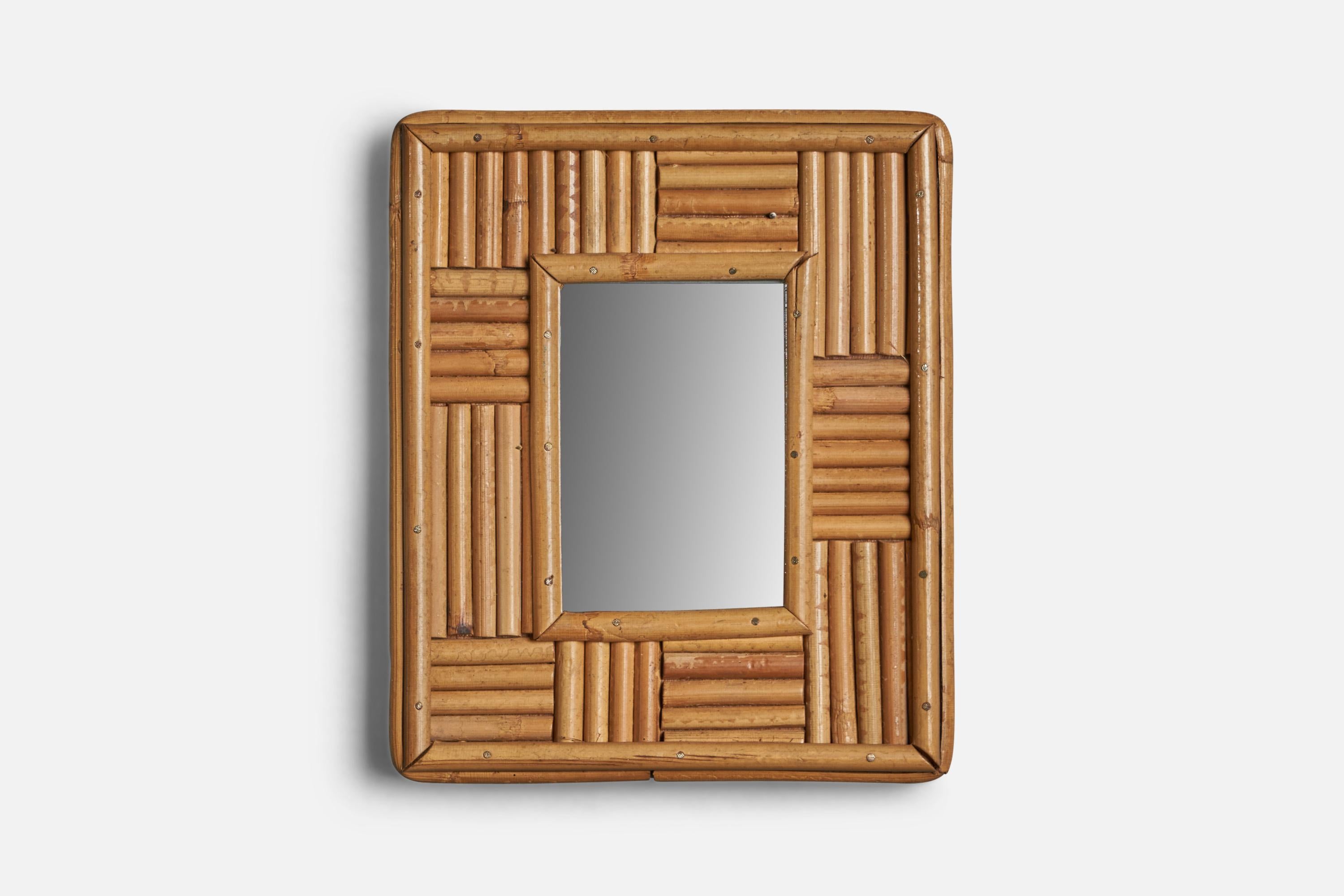 A small wall mirror or table mirror designed and produced in Italy, c. 1960s.
With mountings for either wall or table top.